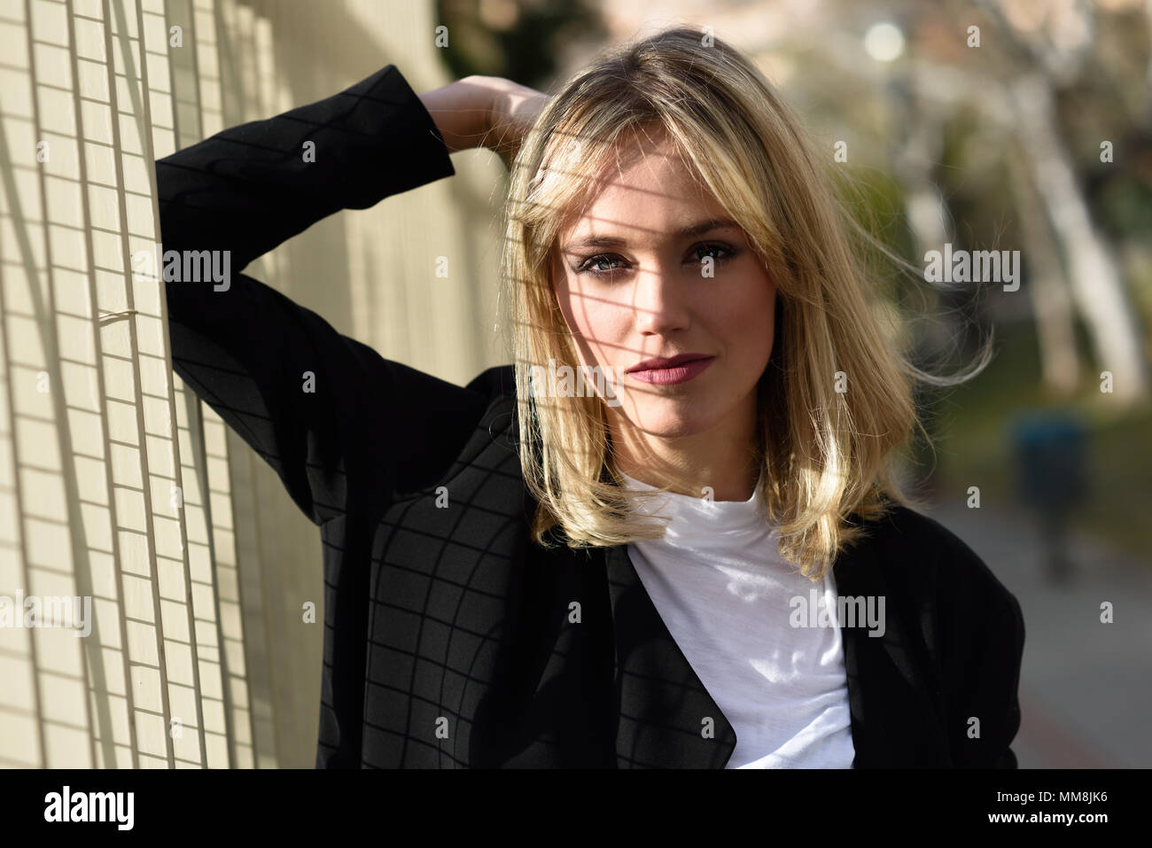 Beautiful Blonde Woman In Urban Background Young Girl