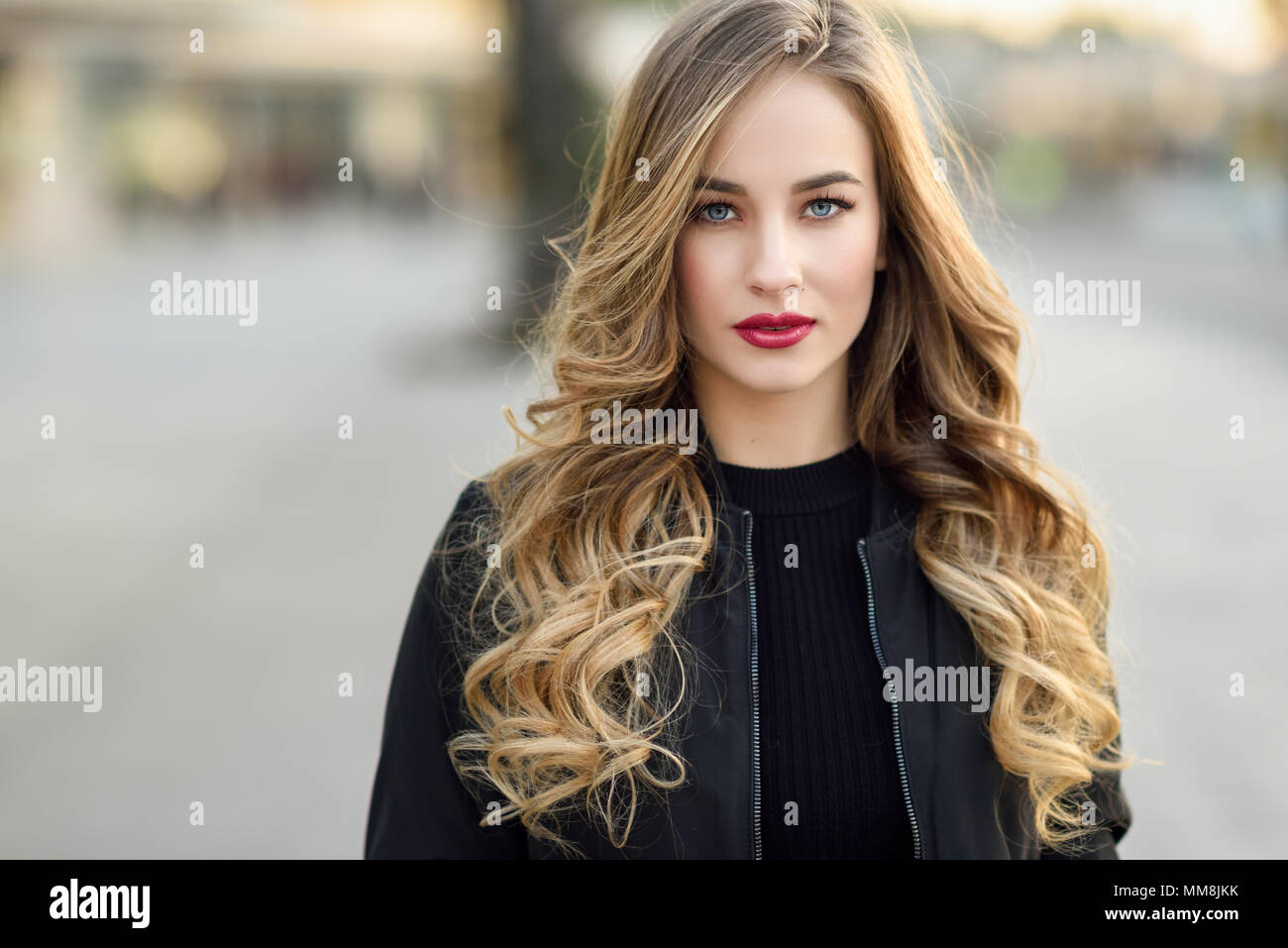 Close Up Portrait Of Young Blonde Girl With Beautiful Blue Eyes