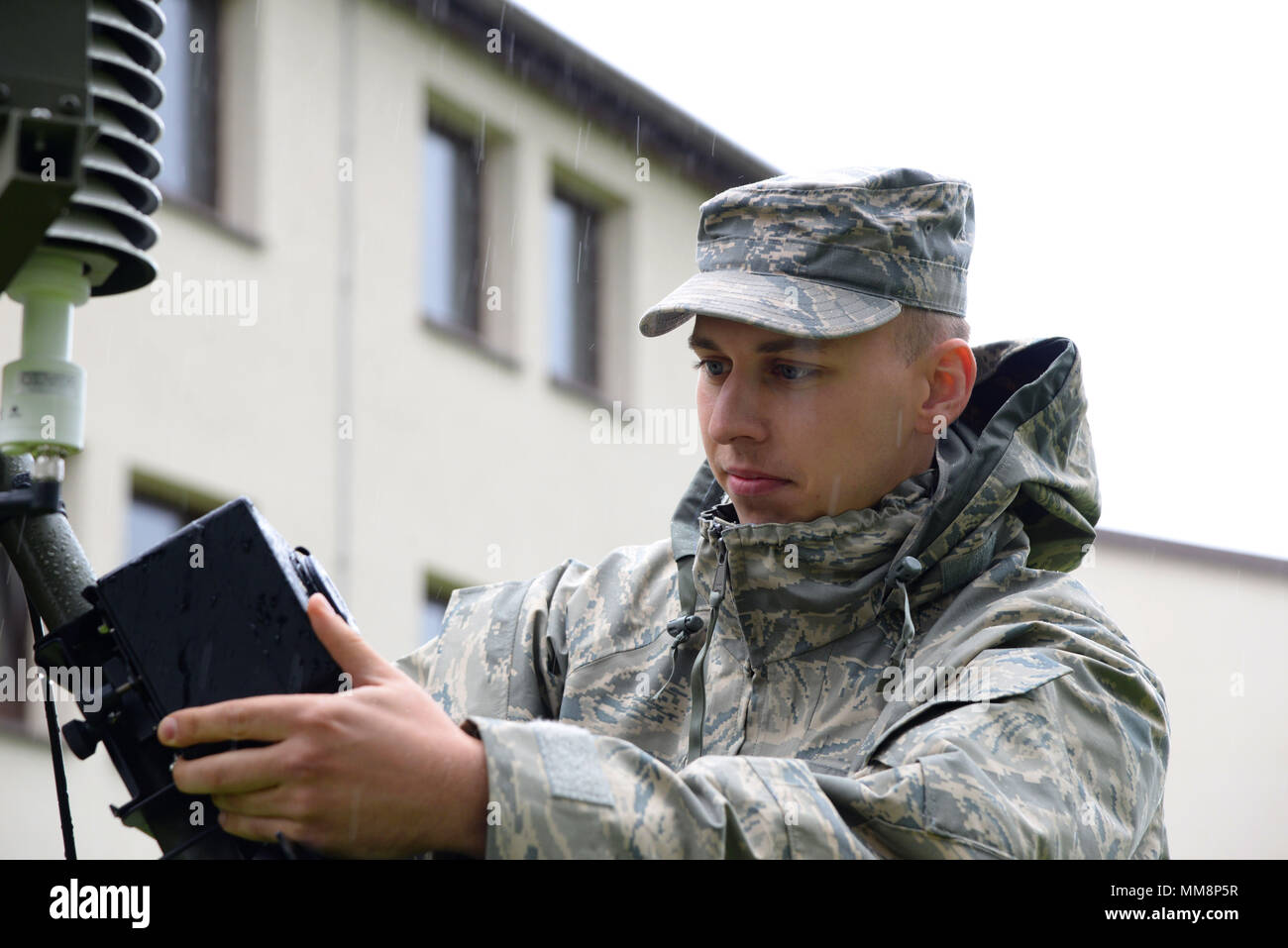 U.S. Air Force Senior Airman Dylan Scott, 7th Weather Squadron regional weather maintenance technician, performs final checks on a TMQ-53, Tactical Meteorological Observing System, during a demonstration at the Warfighter Weather Conference on Kapaun Air Station, Germany, Sept. 14, 2017. The Warfighter Weather Conference brought together 33 units assigned to several different combatant commands, NATO partners, and sister services with the intent to educate and network between operators and leadership. (U.S. Air Force photo by Airman 1st Class D. Blake Browning) Stock Photo