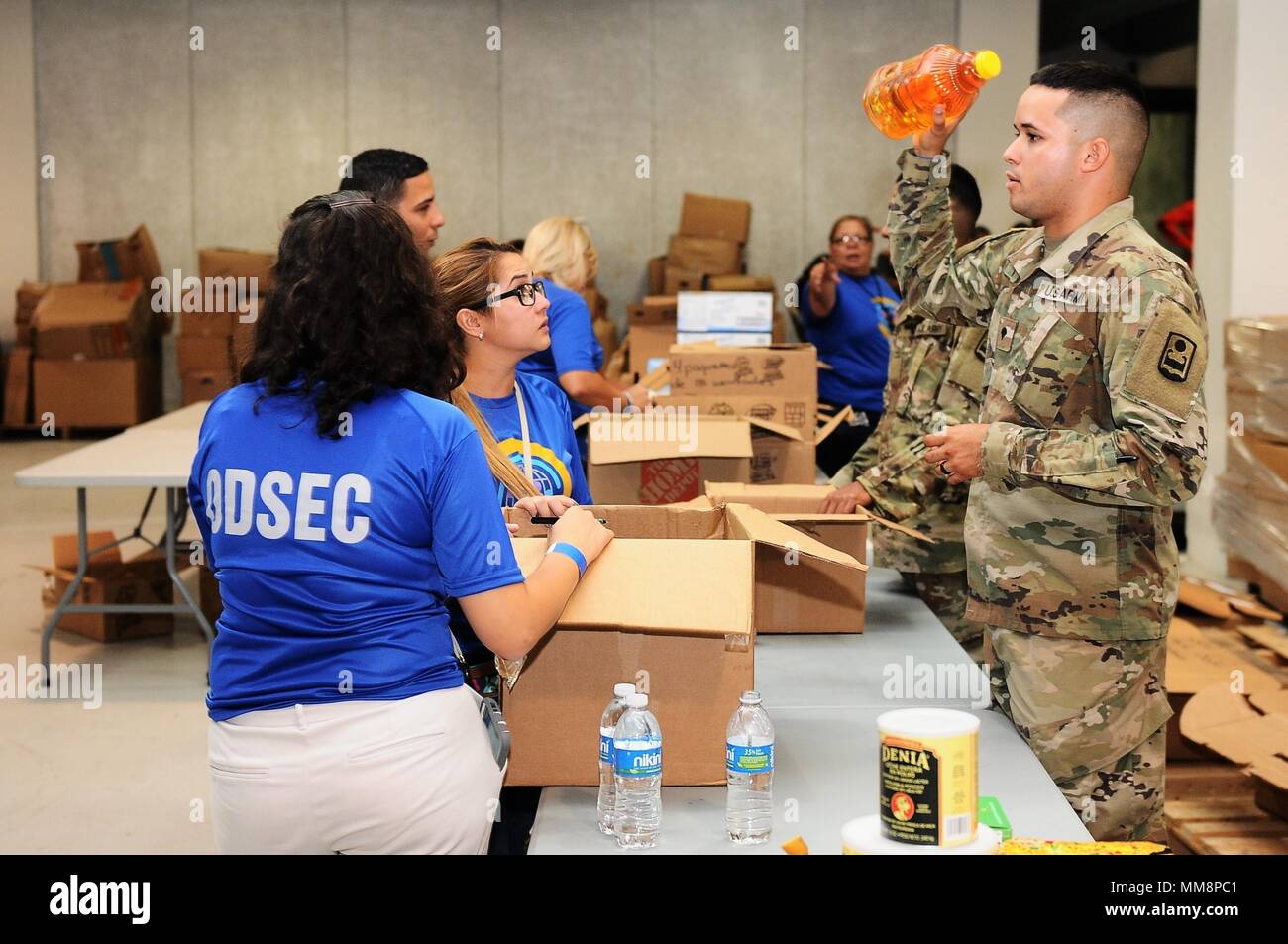Citizen-Soldiers of the Puerto Rico National Guard, in support to different agencies of the Government of Puerto Rico, were in charged of the logistic, transportation, and security of the supplies collected for the people affected by the Hurricane Irma.The priorities are the evacuation of US citizens from St. Marten, route clearance and debris removal from the roadways of Puerto Rico, as well as water and food distribution to areas in need. Stock Photo