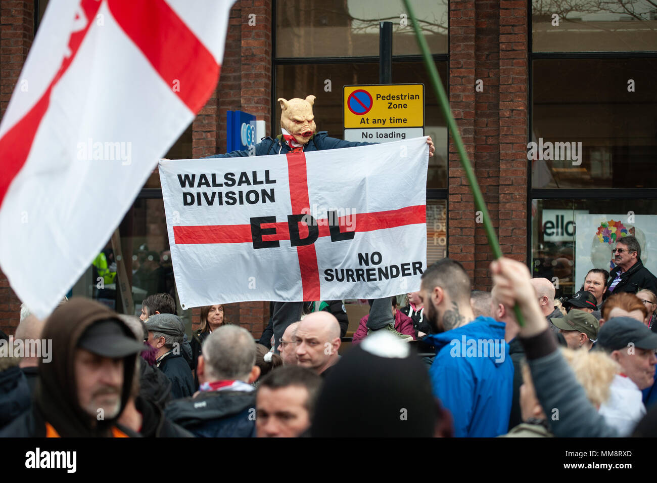 Walsall, West Midlands, UK. 7th April 2018. Pictured: An EDL supporter wears a pig mask at the rally.  / Up to 60 English Defence League supporters ta Stock Photo