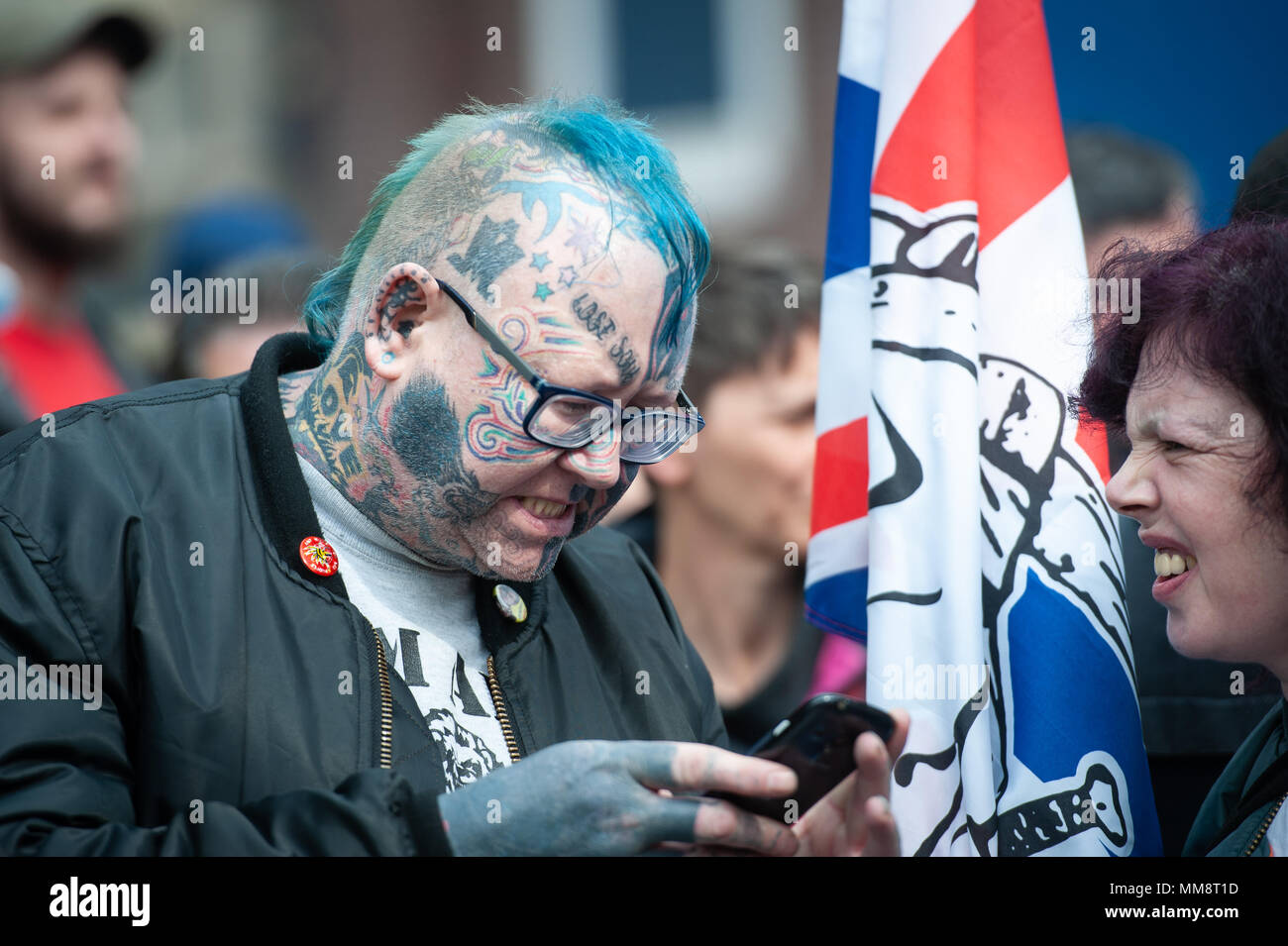 Walsall, West Midlands, UK. 7th April 2018. Pictured: A heavily tatooed man attends the EDL demonstration.  / Up to 60 English Defence League supporte Stock Photo