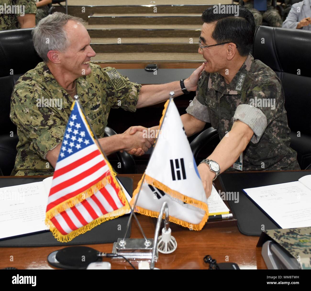170914-N-TB148-063  BUSAN, Republic of Korea (Sept. 14, 2017) Vice Adm. Phil Sawyer, left, commander of U.S. 7th Fleet, and Vice Adm. Jung, Jin-Sup, commander of Republic of Korea (ROK) Fleet, shake hands after signing a memorandum of understanding (MOU). The MOU is designed to strengthen the relationship between the U.S. and ROK navies. Sawyer's visit includes meetings with U.S. and ROK military leaders as well as the signing of a component-level MOU with the ROK navy to enhance coordination and training in support of the U.S.and ROK alliance. (U.S. Navy photo by Mass Communication Specialist Stock Photo