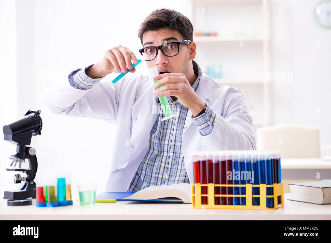 Chemistry student doing chemical experiments at classroom activity ...