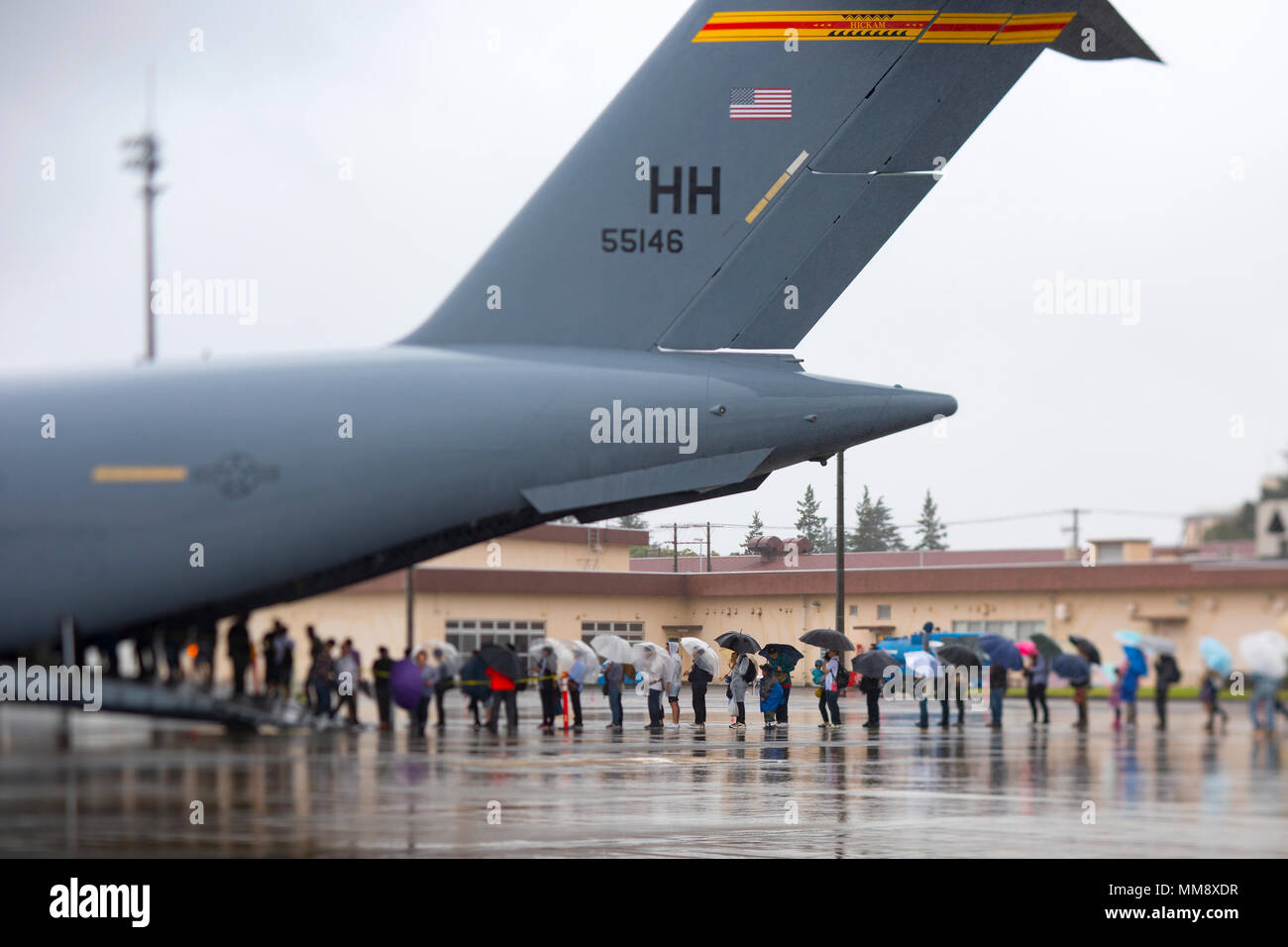 Spectators wait in line to enter a C-17 Globemaster III during the 2017 Japanese-American Friendship Festival at Yokota Air Base, Japan, Sept. 17, 2017. In addition to static displays and live music, the festival offered a variety of American and Japanese food items. The festival is designed to bolster the bilateral relationship shared by the United States and Japan. (U.S. Air Force photo/Yasuo Osakabe) Stock Photo