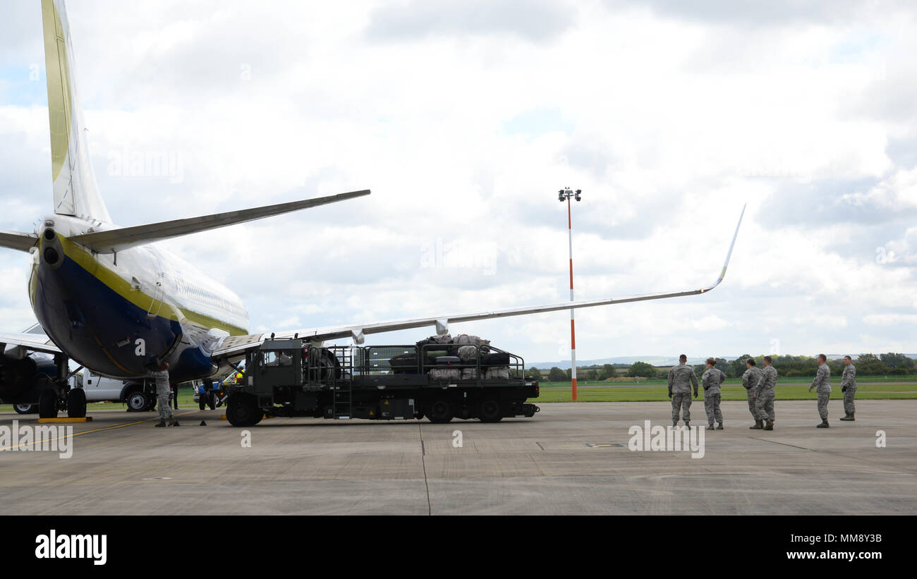 Luggage is retrieved from an aircraft at Fairford Royal Air Force Base, U.K., Sept. 11, 2017. U.S. Strategic Command bomber forces regularly conduct combined theater security cooperation engagements with allies and partners, demonstrating the U.S. capability to command, control and conduct bomber missions across the globe. Bomber missions demonstrate the credibility and flexibility of the military's forces to address today's complex, dynamic and volatile global secruty environment. (U.S. Air Force photo/Staff Sgt. Benjamin Raughton) Stock Photo