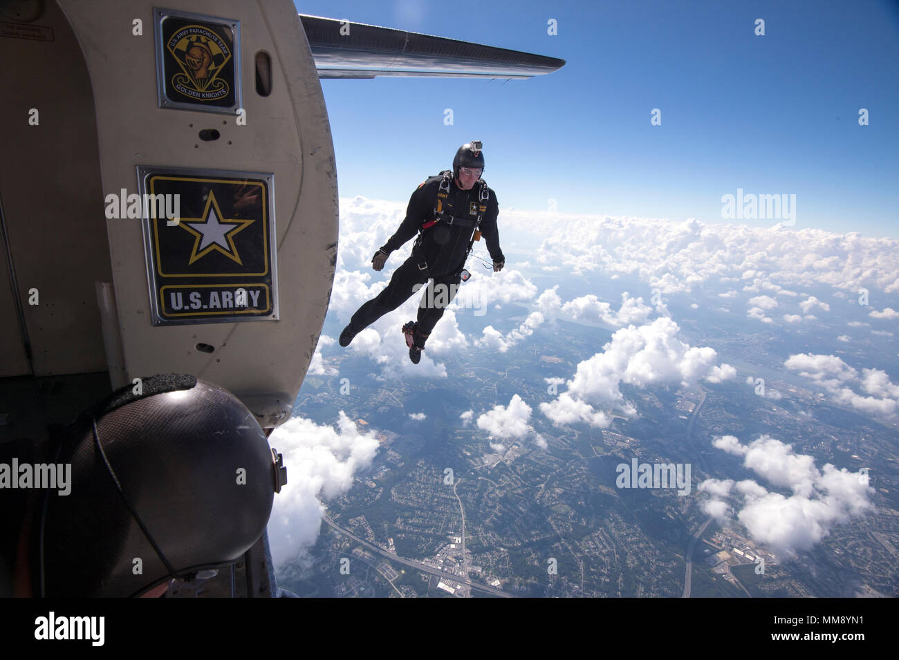 JOINT BASE ANDREWS, Md. -Sergeant First Class, Brian Karst, a  member of the United States Army Parachute Team, the 'Golden Knights,' takes part in a demonstration jump over Joint Base Andrews during the annual Joint Base Andrws Air Show on September 17, 2017.    A variety of presentations from military services and other organizations will be present including the KC-135, the F-16 Fighting Falcon, NASA’s Super Guppy, and the UH-1N Iroquois.    US Air National Guard Photo by Staff Sgt. Christopher S. Muncy Stock Photo