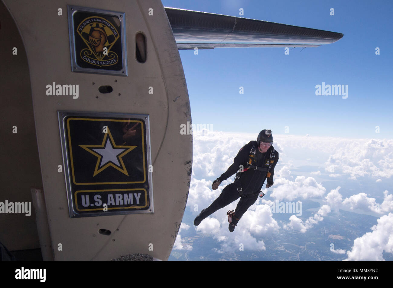 JOINT BASE ANDREWS, Md. -Sergeant First Class, Brian Karst, a  member of the United States Army Parachute Team, the 'Golden Knights,' takes part in a demonstration jump over Joint Base Andrews during the annual Joint Base Andrws Air Show on September 17, 2017.    A variety of presentations from military services and other organizations will be present including the KC-135, the F-16 Fighting Falcon, NASA’s Super Guppy, and the UH-1N Iroquois.    US Air National Guard Photo by Staff Sgt. Christopher S. Muncy Stock Photo