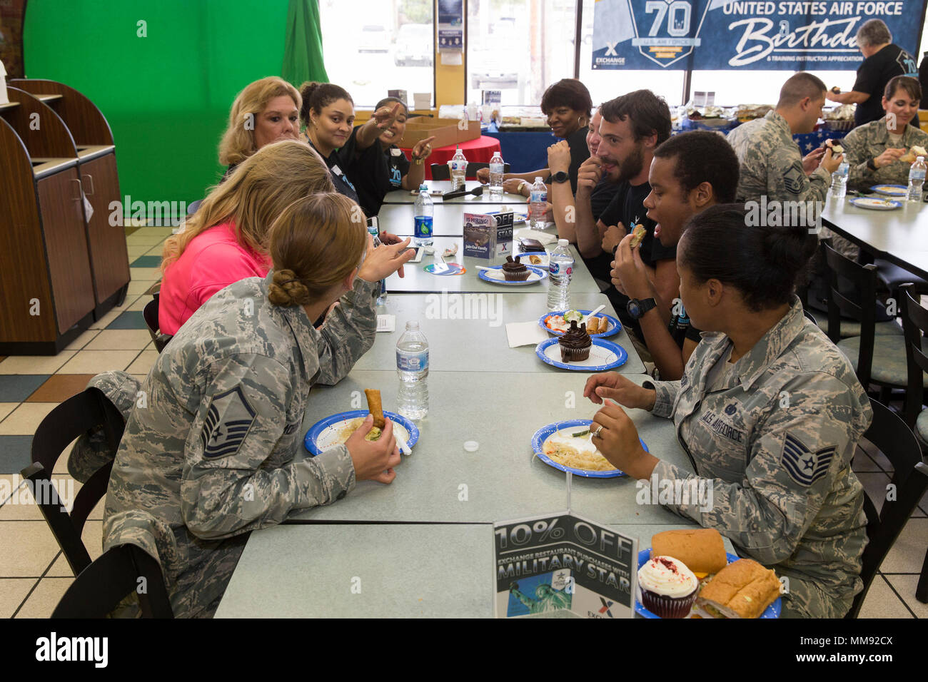 The basic military training mini mall troop store for prospective airmen held a luncheon for training instructors on Joint Base San Antonio-Lackland to recognizes their efforts and to commemorate the 70th Birthday of the U.S. Air Force Sept. 18, 2017. The luncheon was organized by Pamela Brown, BMT PX store manager, and Marvie Riouax, BMT PX assistant store manager, and featured food and music for some of the TIs that work in the area. The facility provides services for over 200 TI a day. (U.S. Air Force by Ismael Ortega.) Stock Photo