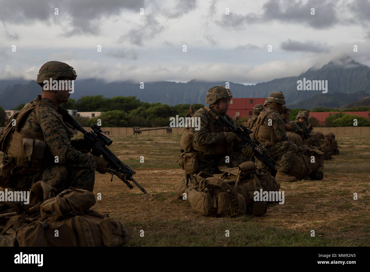 U.S. Marines with 3rd Battalion, 3rd Marine Regiment, provide security during the retrograde of personnel from Exercise Bougainville II  at Marine Corps Air station Kaneohe Bay, Sept. 15, 2017. The exercise prepares the Marines for service as a forward deployed force in the Pacific by training them to fight as a Ground Combat Element in a Marine Air-Ground Task Force. (Marine Corps Photo by: Sgt. Alex Kouns) Stock Photo