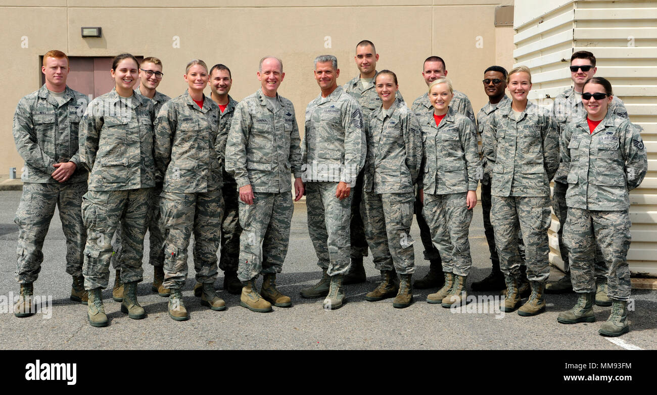 U.S. Air Force Maj. Gen. Donald Dunbar, Wisconsin’s adjutant general, and Chief Master Sgt. Thomas Safer, 115th Fighter Wing command chief, pose for a photo with Airmen from the 115th FW, at Kunsan Air Base, Republic of Korea, Sept. 15, 2017. Dunbar and Safer visited the 115th FW Airmen deployed to Kunsan for a 4-month rotation as part of a Theater Security Package, which helps maintain regional security and stability.  (U.S. Air Force photo by Senior Airman Colby L. Hardin) Stock Photo