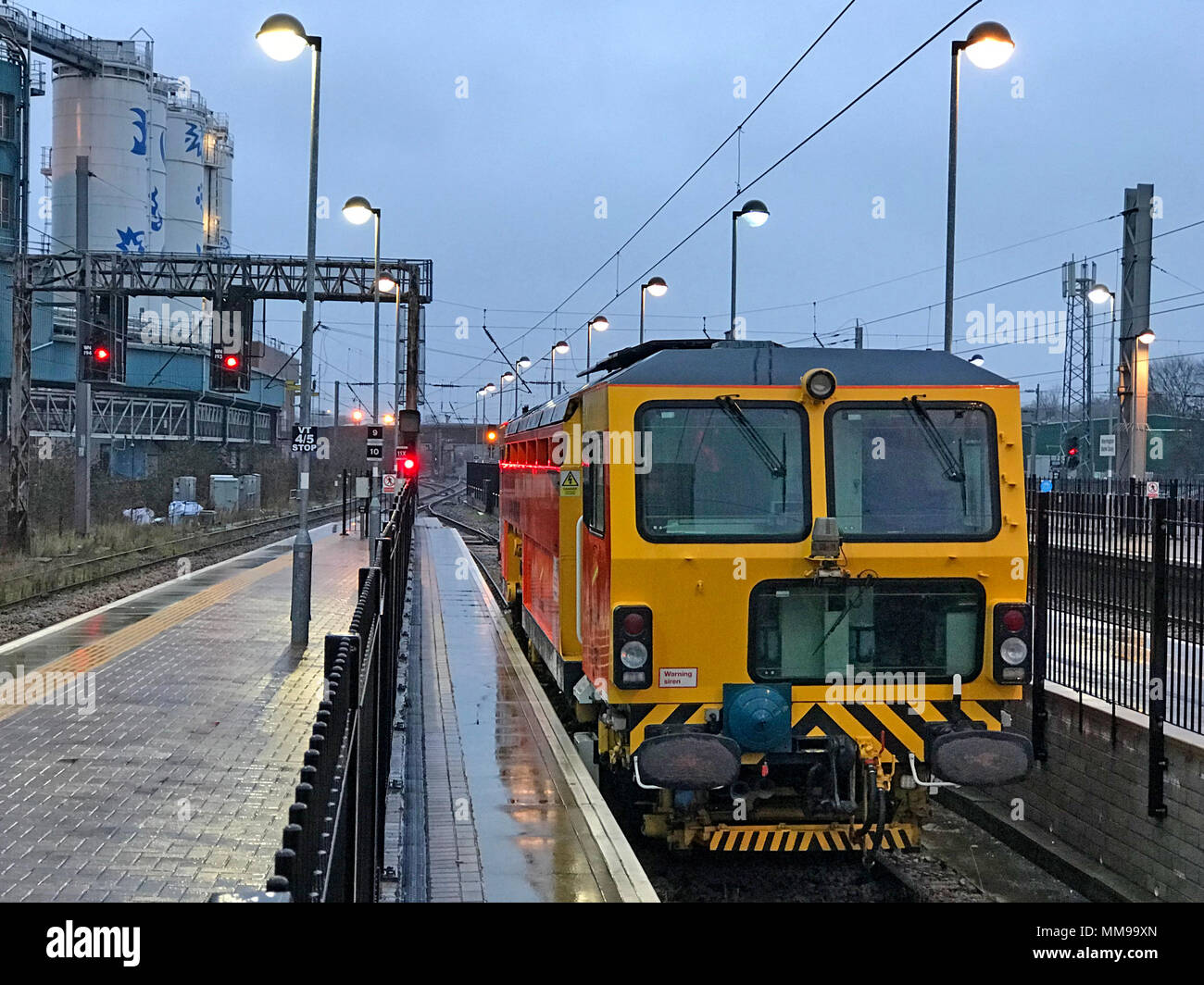 Railway track maintenance engine vehicle, Warrington Bank Quay station at dusk, Cheshire, England, UK, dusk, winter Stock Photo