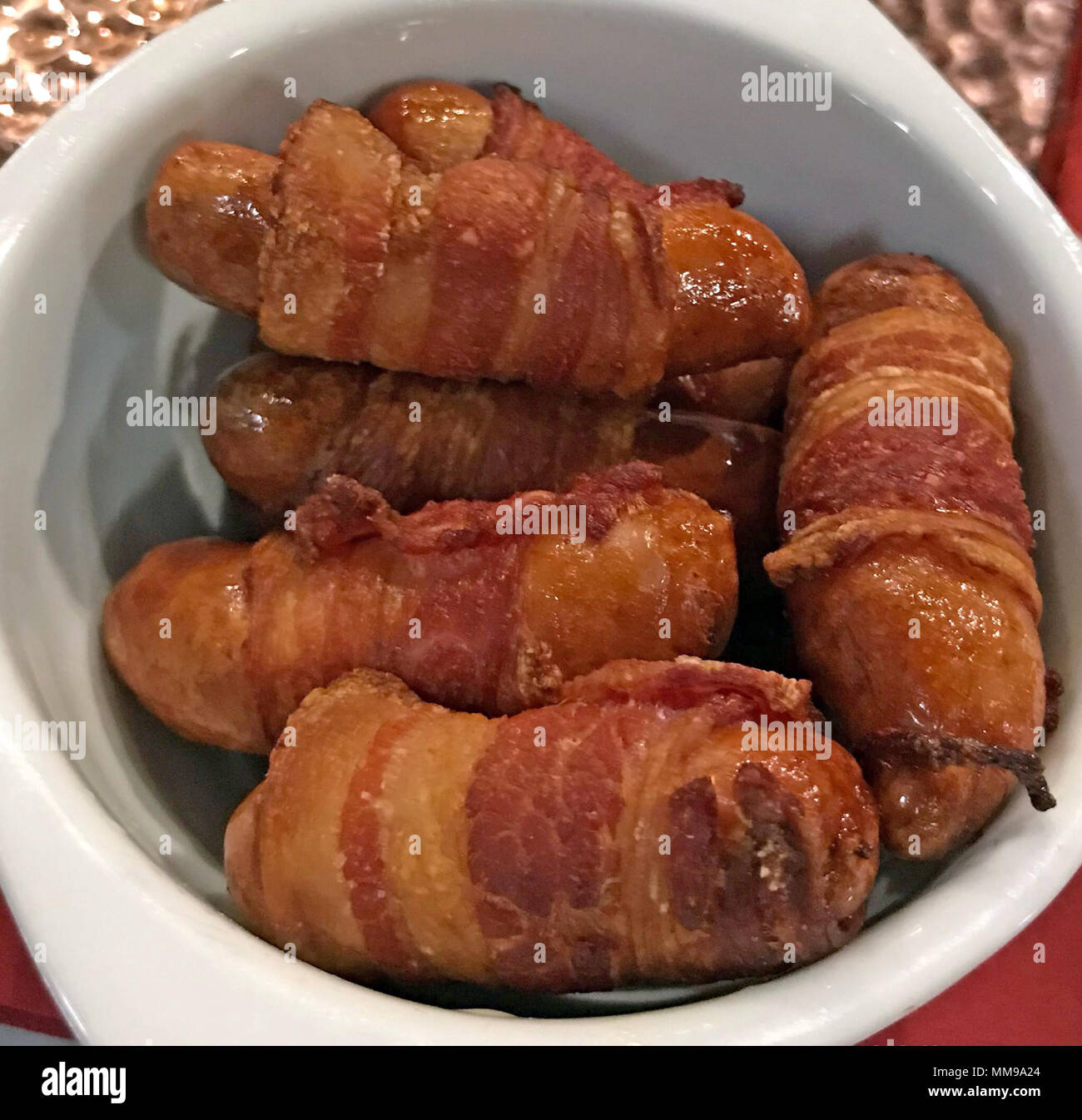 Pigs In Blankets, sausages in Bacon, Pork food product, Pub snack Stock Photo