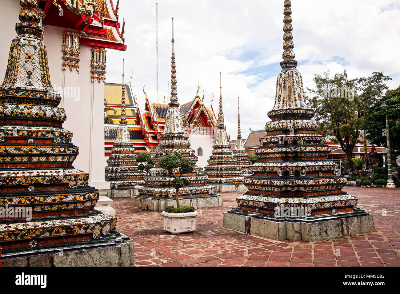 The grounds at Wat Pho, a Buddhist temple in Phra Nakhon district, Bangkok, Thailand.  Known also as the Temple of the Reclining Buddha, its official  Stock Photo