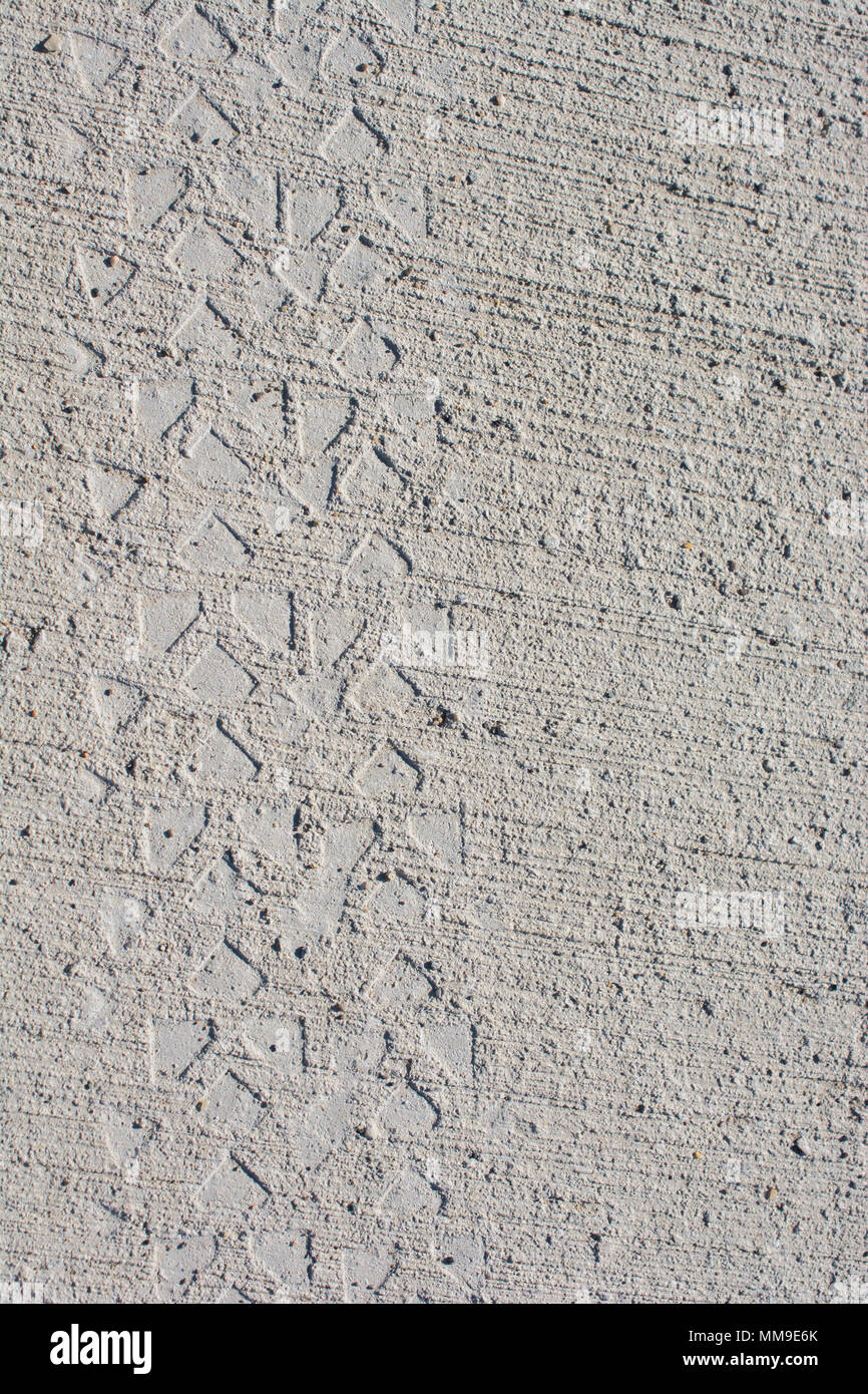 Tire tracks tire marks on Concrete as abstract grunge texture Stock