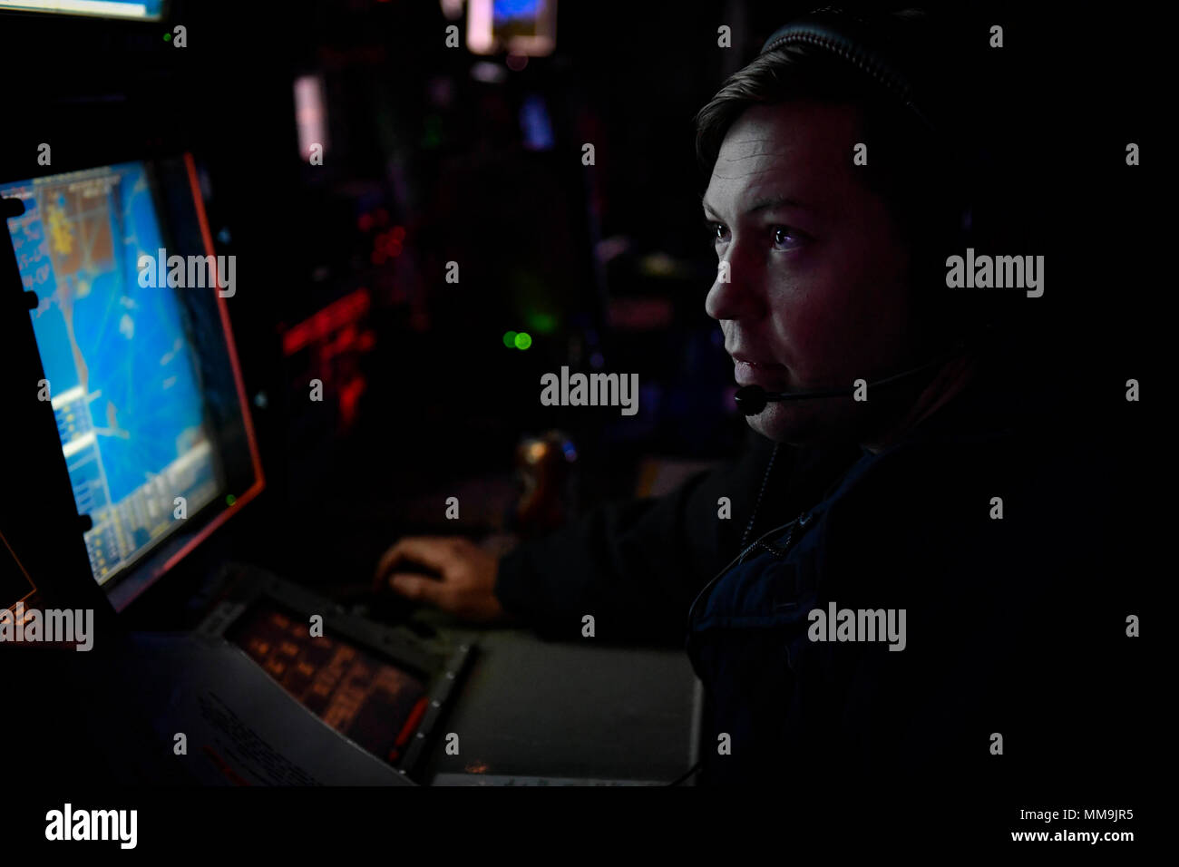 170915-N-UY653-206 BALTIC SEA (Sept. 15, 2017) Operations Specialist 2nd Class Jonathan Materni stands watch in the combat information center aboard the Arleigh Burke-class guided-missile destroyer USS Oscar Austin (DDG 79). Oscar Austin is on a routine deployment supporting U.S. national security interests in Europe, and increasing theater security cooperation and forward naval presence in the U.S. 6th Fleet area of operations. (U.S. Navy photo by Mass Communication Specialist 2nd Class Ryan Utah Kledzik/Released) Stock Photo