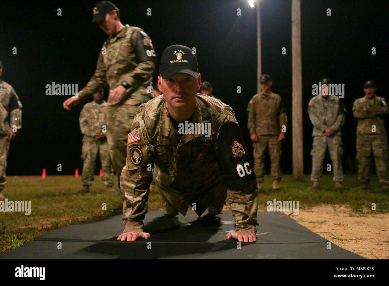 U.S. Soldiers demonstrates the push up event before the Army Physical ...