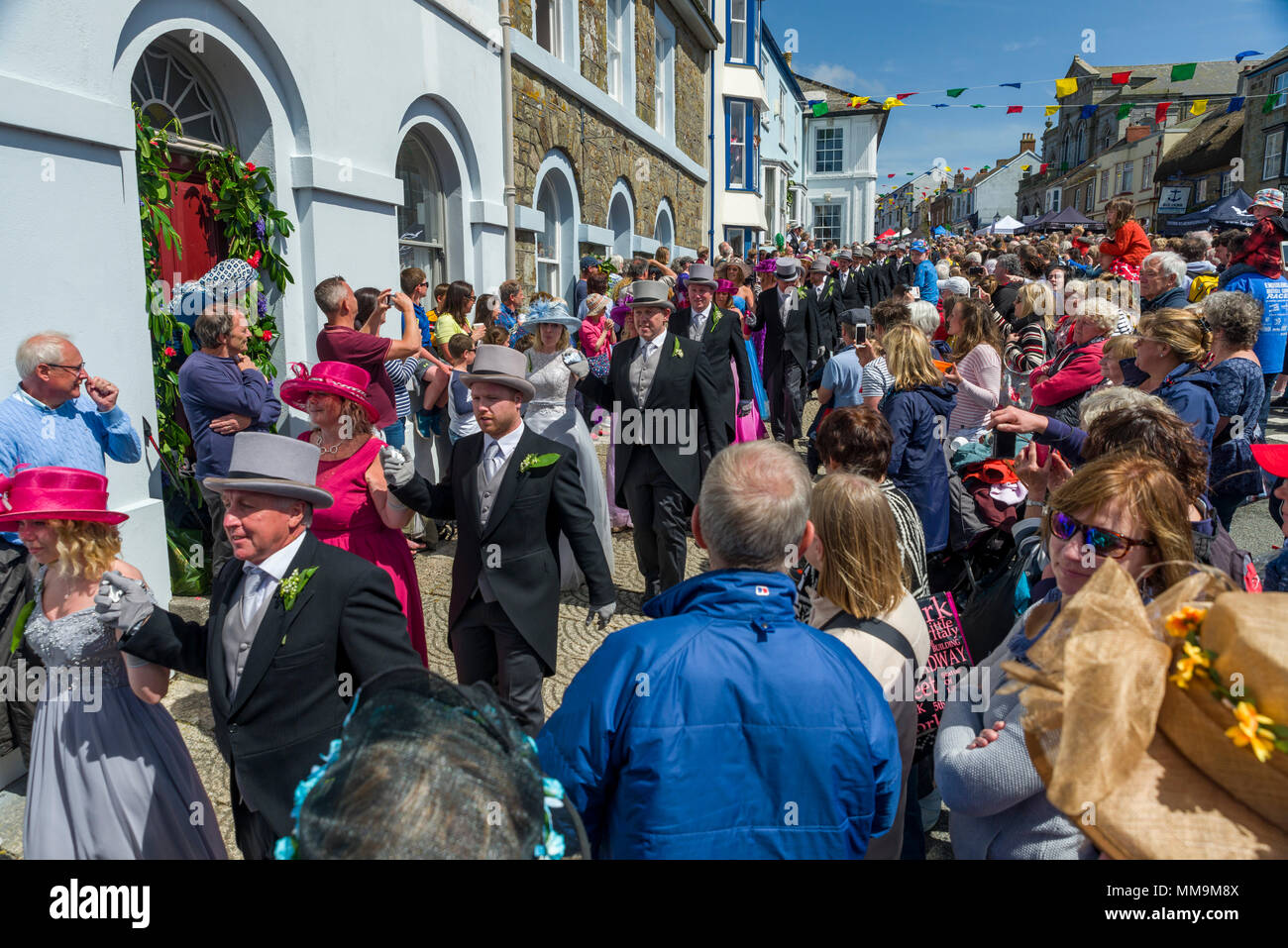 Editorial: Unknown members of the public, potential logo and other trademarks. Helston, Cornwall, UK, 08/05/2018. Dancers make their way through the s Stock Photo
