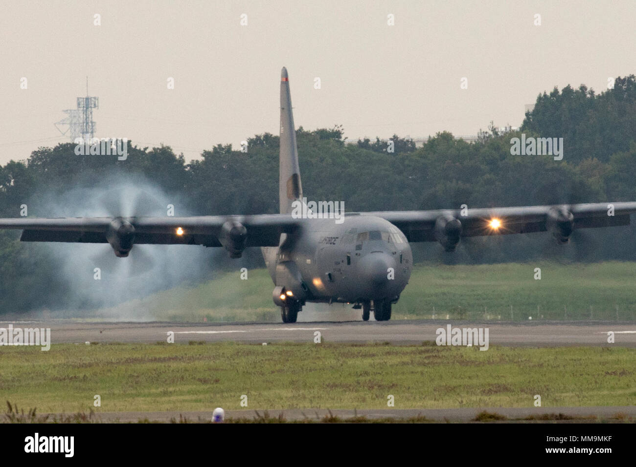 A C-130J Super Hercules touches down at Yokota Air Base, Japan, Sept. 20, 2017. This is the fifth C-130J delivered to Yokota and the first from Ramstein Air Base. Crewmembers from the 36th Airlift Squadron flew halfway around the world to deliver an aircraft here. Yokota serves as the primary Western Pacific airlift hub for U.S. Air Force peacetime and contingency operations. Missions include tactical airland, airdrop, aeromedical evacuation, special operations and distinguished visitor airlift. (U.S. Air Force photo by Yasuo Osakabe) Stock Photo