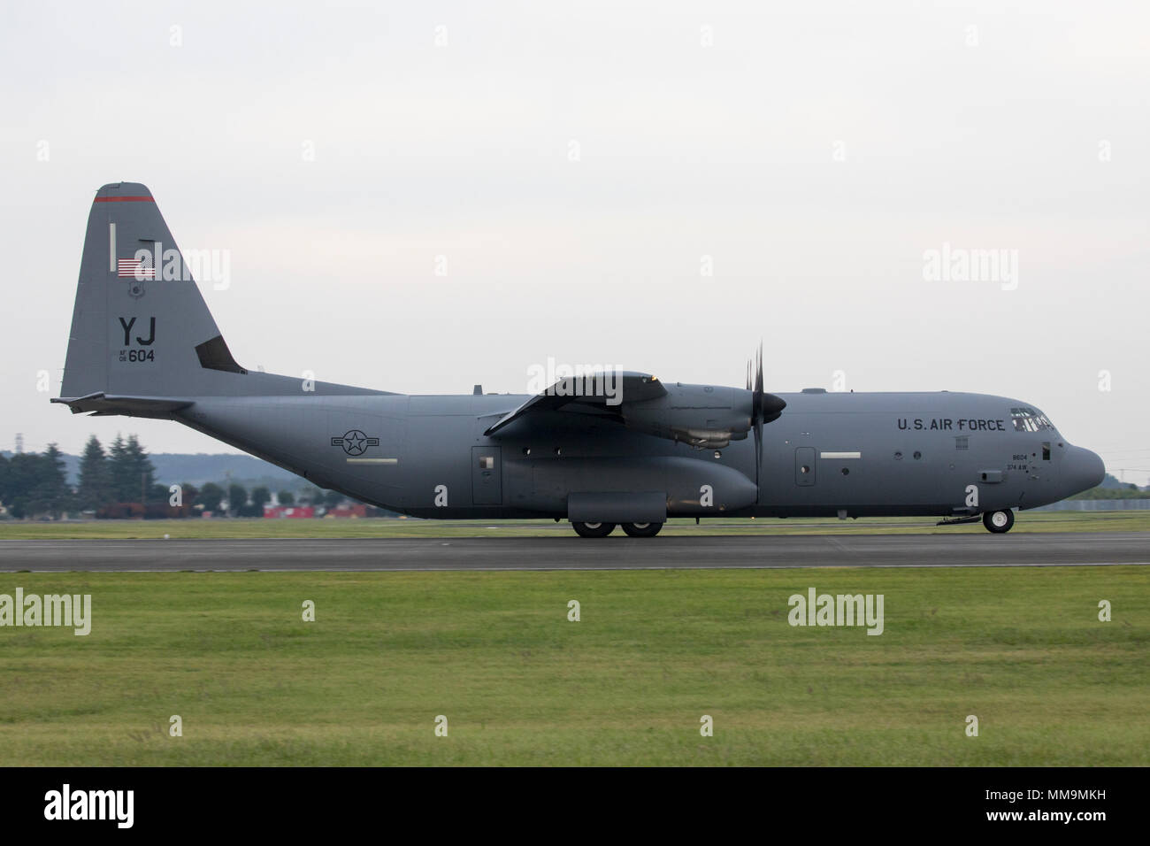 A C-130J Super Hercules assigned to the 36th Airlift Squadron lands at Yokota Air Base, Japan, Sept. 20, 2017. This is the fifth C-130J delivered to Yokota and the first from Ramstein Air Base. Crewmembers from the 36th Airlift Squadron flew halfway around the world to deliver an aircraft here. Yokota serves as the primary Western Pacific airlift hub for U.S. Air Force peacetime and contingency operations. Missions include tactical airland, airdrop, aeromedical evacuation, special operations and distinguished visitor airlift. (U.S. Air Force photo by Yasuo Osakabe) Stock Photo
