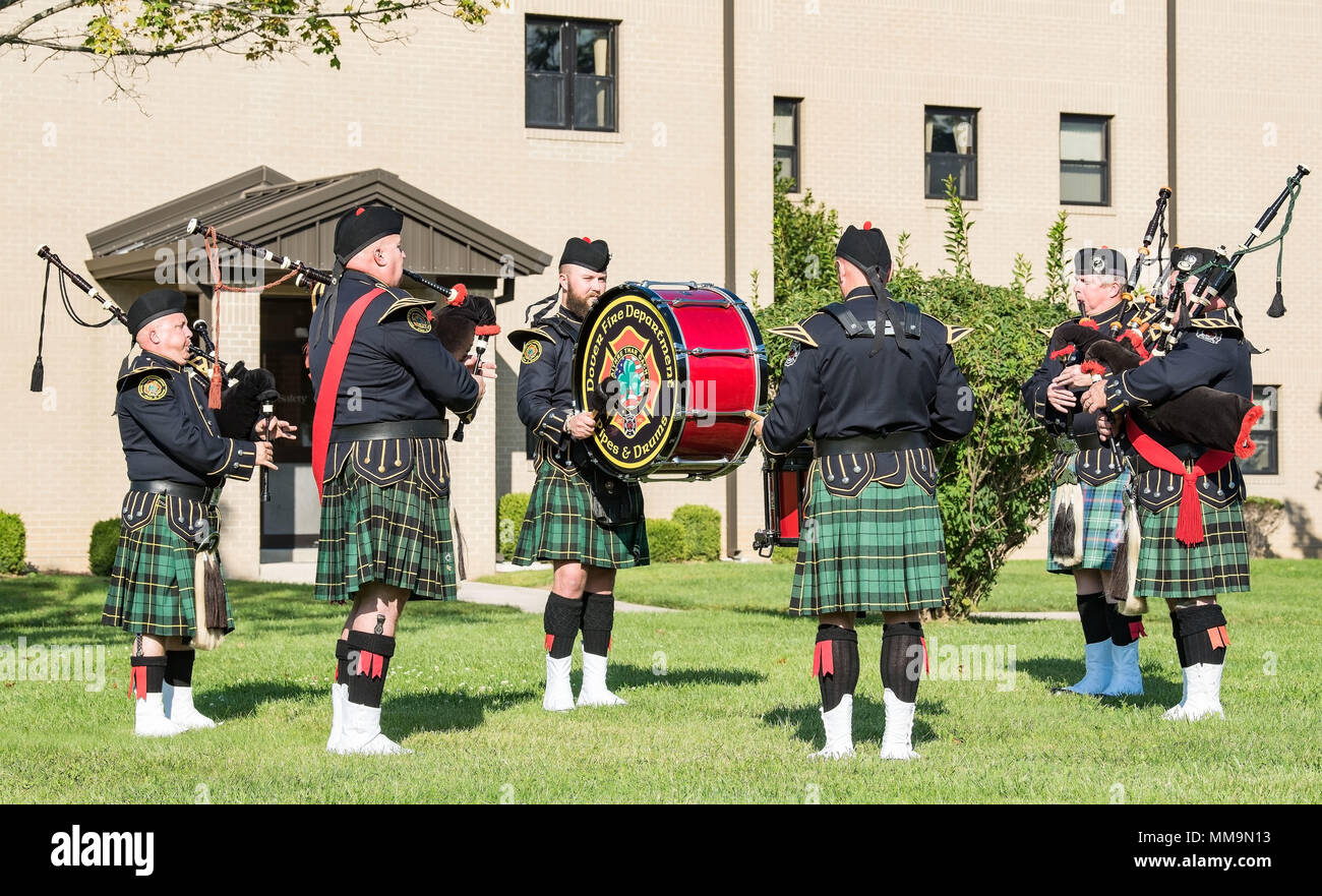 Members of the Dover Fire Pipes and Drums of Dover, Del., play “Amazing Grace” during the National Prisoner of War and Missing in Action Recognition Day ceremony Sept. 15, 2017, on Dover Air Force Base, Del. Positioned left to right, Ryan Knowles, pipes; Michael O’Connor, pipe major; Remy Gooch, bass drum; David Truax, drum sergeant; Timothy Kline, pipes; and Joseph Moran, pipe sergeant. (U.S. Air Force photo by Roland Balik) Stock Photo