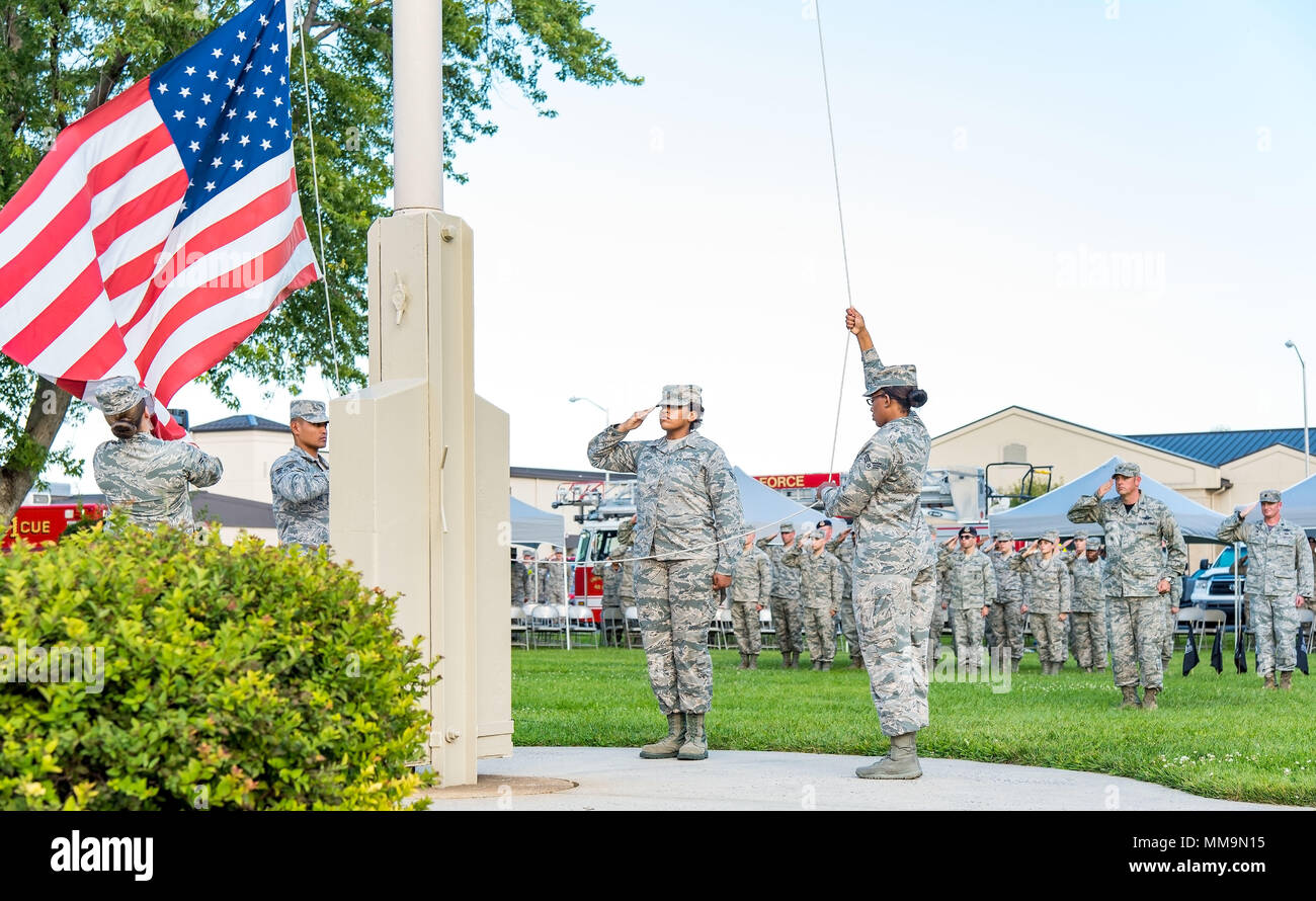 Members of the Dover Air Force Base Honor Guard lower the U.S. flag during the National Prisoner of War and Missing in Action Recognition Day ceremony Sept. 15, 2017, on Dover Air Force Base, Del. The names of 178 fallen service members from previous wars and conflicts that have been repatriated this past year were read by six members of the Armed Forces Medical Examiner System during the ceremony. (U.S. Air Force photo by Roland Balik) Stock Photo