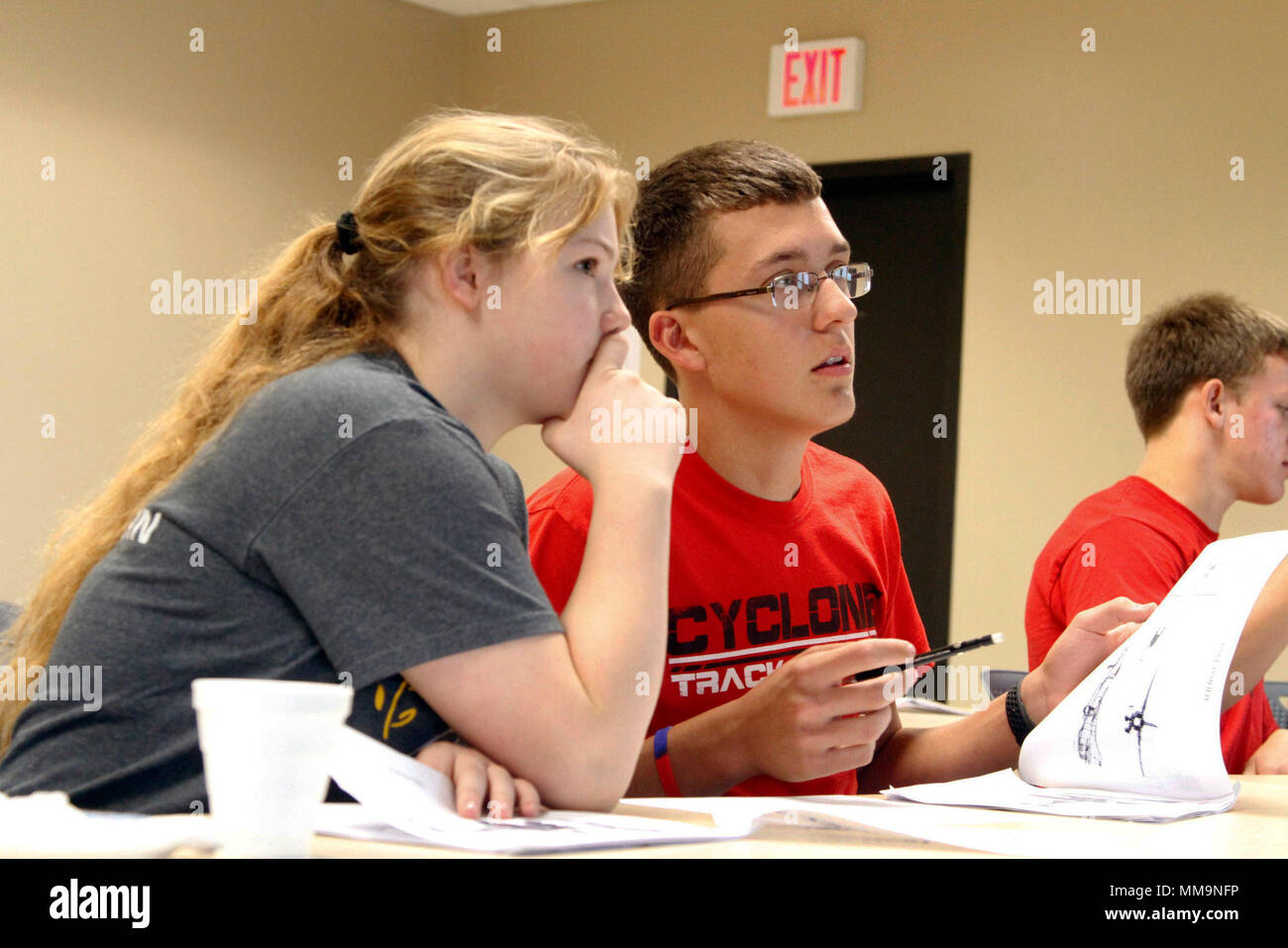 High School Students from Harlan Community High School, in Harlan, Iowa, attempt to decipher satellite images in order to win prizes during the Iowa National Guard’s inaugural STEM (Science, Technology, Engineering and Math) Day event at Camp Dodge, in Johnston, Iowa, on Sept. 20. Students from Harlan and Davis County Community High School, in Bloomfield, Iowa, attended the event which was organized in an effort to showcase the applications of science, technology, engineering and mathematics in day-to-day military operations. (U.S. Army National Guard photo by Staff Sgt. Christie Smith) Stock Photo