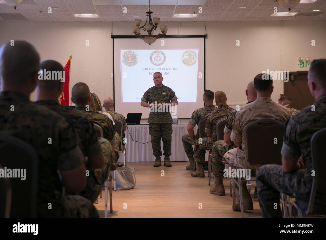 Col. Ricardo Martinez, chief of staff, speaks at the Suicide Prevention Symposium, held aboard the Combat Center, September 19, 2017. The symposium,  organized by the behavioral health branch of Marine Corps Community Services, provided Combat Center leadership with information and resources to aid in dealing with mental health and suicide prevention. (U.S. Marine Corps photo by Lance Cpl. Isaac Cantrell) Stock Photo