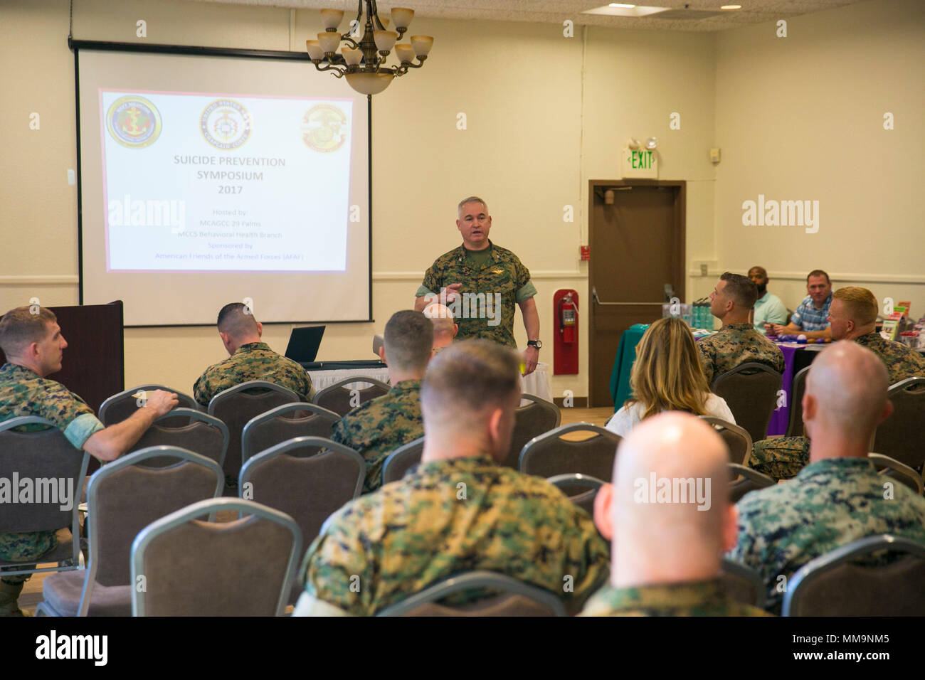 Col. Ricardo Martinez, chief of staff, speaks at the Suicide Prevention Symposium, held aboard the Combat Center, September 19, 2017. The symposium,  organized by the behavioral health branch of Marine Corps Community Services, provided Combat Center leadership with information and resources to aid in dealing with mental health and suicide prevention. (U.S. Marine Corps photo by Lance Cpl. Isaac Cantrell) Stock Photo