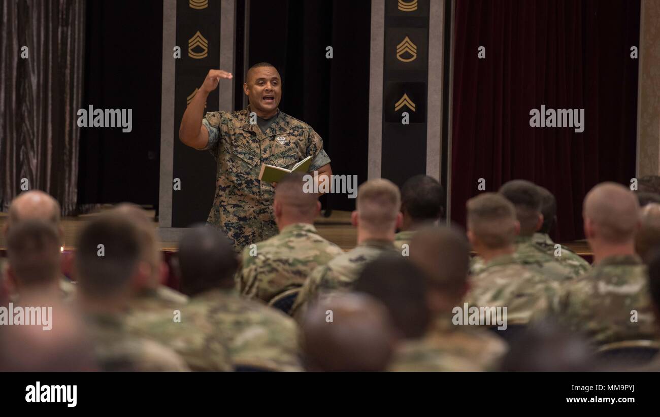 Sgt. Maj. Edward Parsons gives a speech during a noncommissioned officer (NCO) induction ceremony on Joint Base Myer-Henderson Hall, Va., Sept. 22, 2017. Parsons was the guest speaker for ceremony where 76 NCOs from The Old Guard were formally inducted into the corps of non commissioned officers. (U.S. Army photos by Sgt. George Huley) Stock Photo