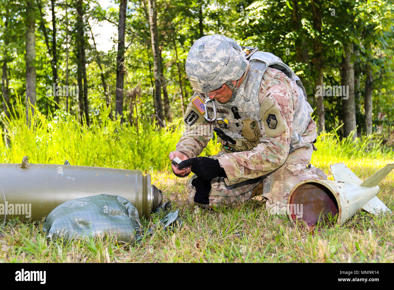 Sgt. Paul White, assigned to 9th Chemical Company (Technical Escort) at  Joint Base Lewis-McChord, Wash., uses a camera to document the type of  ordnance device he has encountered during the fifth annual