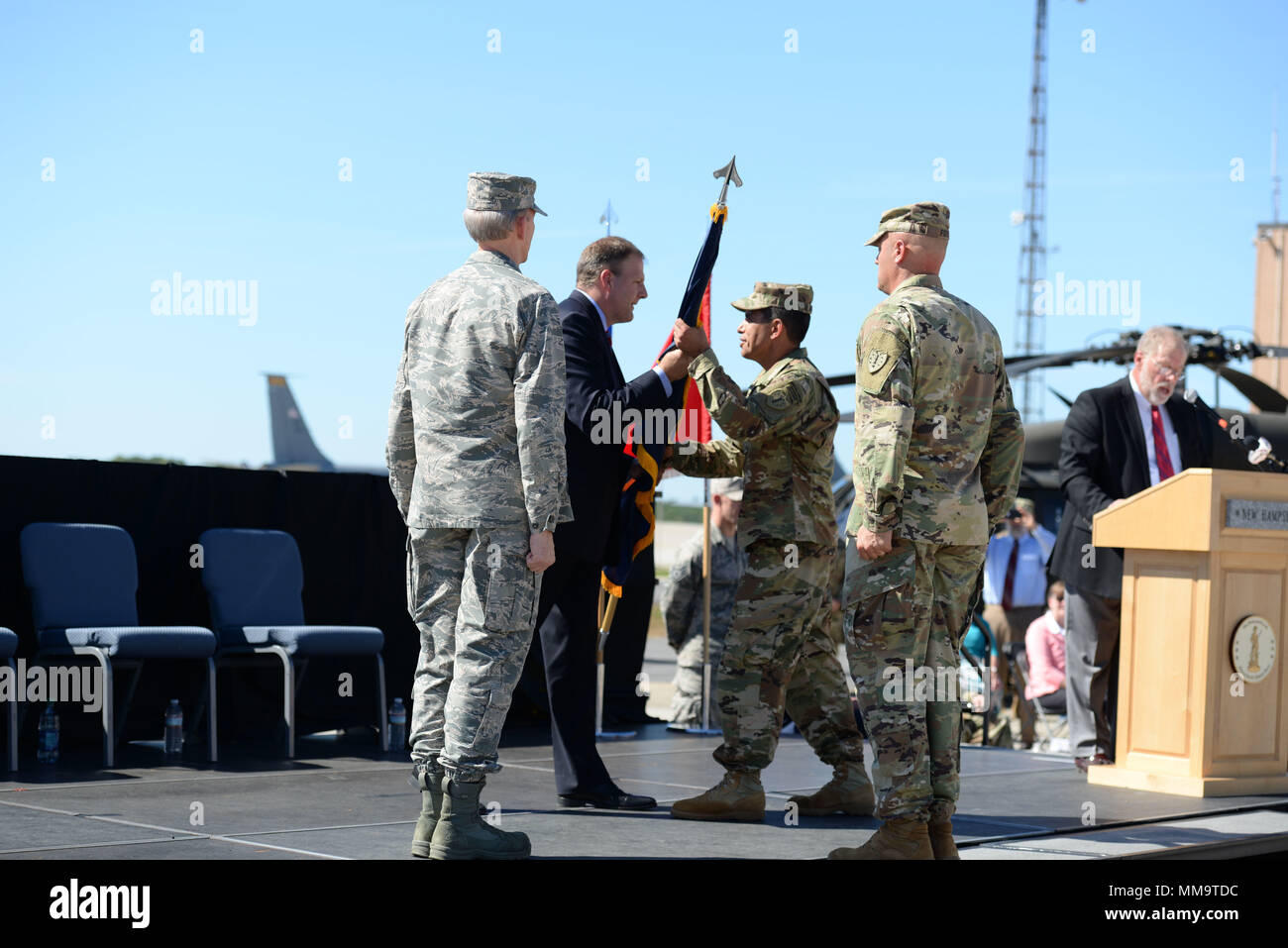 Gov. Christopher T. Sununu passes the colors to Brig. Gen. David J. Mikolaities during change of command ceremony at Pease Air National Guard Base, Sept. 23, 2017. Brig. Gen. David Mikolaities assumes duties as the Adjutant General, New Hampshire National Guard from Maj. Gen. William Reddel. (N.H. National Guard photo by Senior Airman Ashlyn J. Correia) Stock Photo