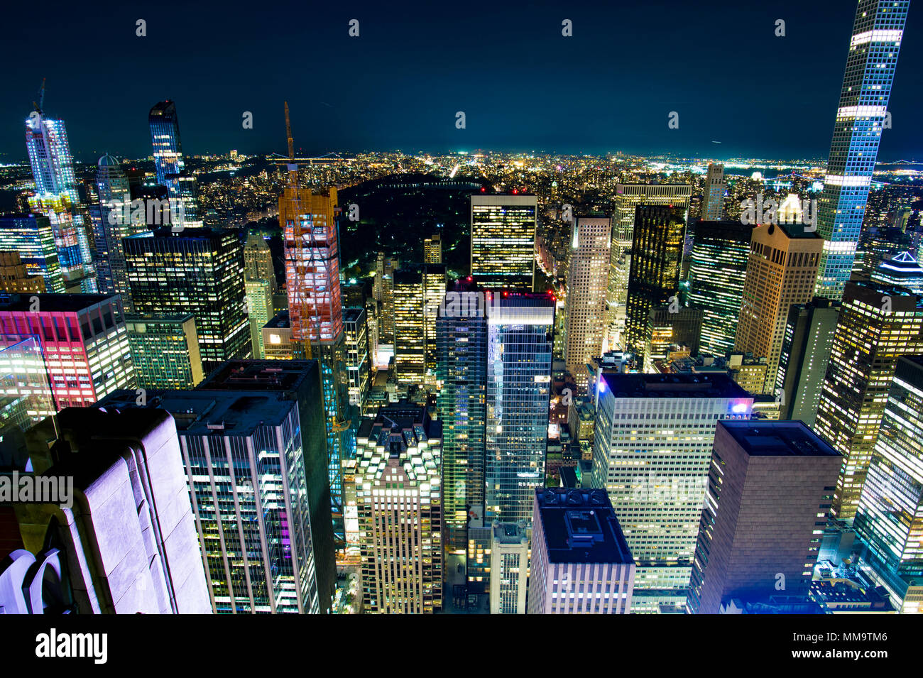 Aerial view of Manhattan skyline illuminated at night. New York, USA ...