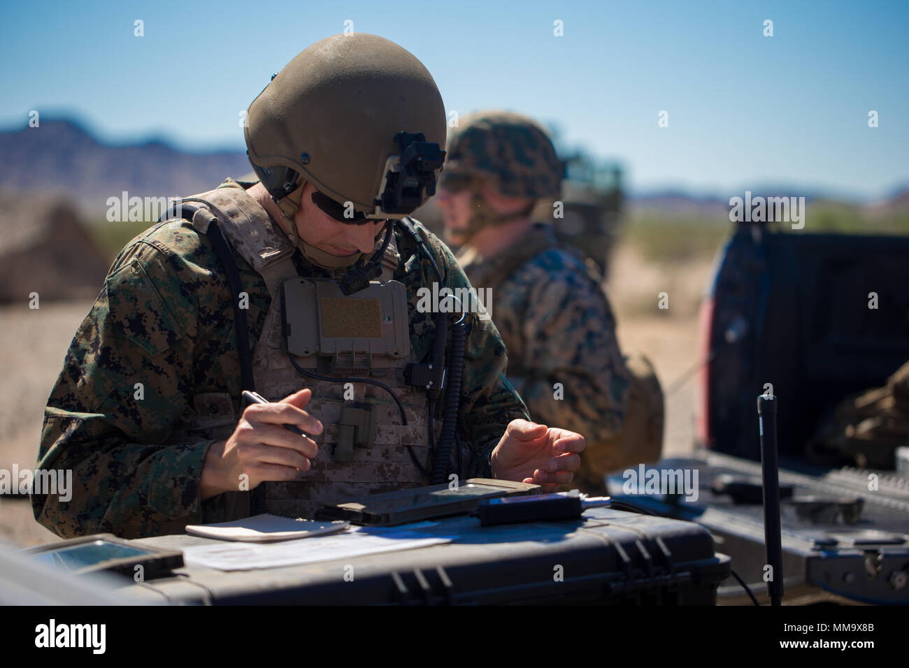 U.S Marine Corps Maj. Josh Foster, Air Ordnance Disposal Instructor with Marine Aviation Weapons and Tactics Squadron One (MAWTS-1) provide digitally aided close air support using radios and tablets in support of Weapons Tactics Instructors course (WTI) 1-18 at Fire Base Burt, Calif., Sept. 22, 2017. WTI is a seven-week training even hosted by MAWTS-1 cadre, which emphasizes operational integration of the six functions of Marine Corps aviation in support of a Marine Air Ground Task Force and provides standardized advance tactical training and certification of unit instructor qualifications to  Stock Photo