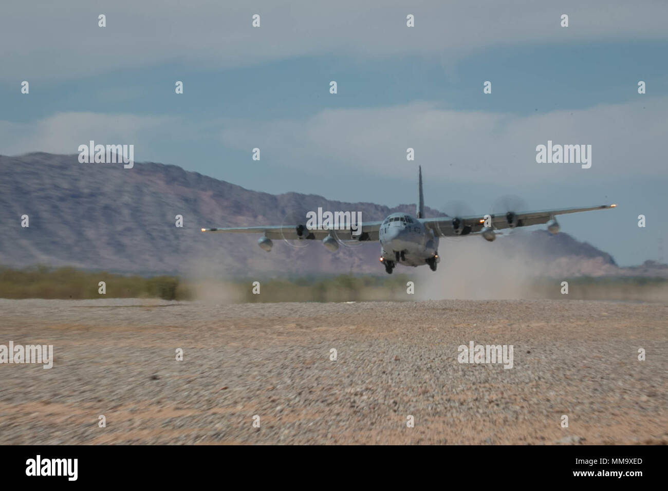 A U.S. Marine Corps KC-130J Super Hercules assigned to Marine Aviation Weapons and Tactics Squadron One (MAWTS-1) conducts a touch and go exercise in support of  Weapons and Tactics Instructors course (WTI) 1-18 at Yuma, Ariz., Sept. 25, 2017. WTI is a seven week training event hosted by Marine Aviation Weapons and Tactics Squadron One (MAWTS-1) cadre which emphasizes operational integration of the six functions of Marine Corps Aviation in support of a Marine Air Ground Task Force and provides standardized advanced tactical training and certification of unit instructor qualifications to suppor Stock Photo