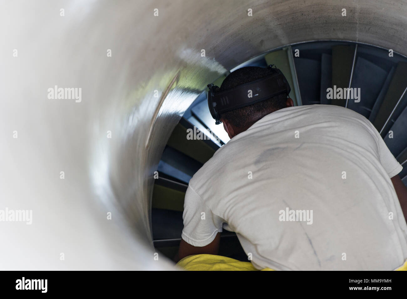 U.S. Air Force Tech. Sgt. Michael Kinsey, crew chief, 482nd Aircraft Maintenance Squadron, Homestead Air Reserve Base, Florida, conducts an aircraft intake inspection on an F-16C Viper from the 482nd Fighter Wing, after the aircraft returned home from being evacuated September 21, 2017. The aircraft of the fighter wing were evacuated to Texas in advance of Hurricane Irma’s landfall with Florida. (U.S. Air Force Photo by Staff Sgt. Kyle Brasier) Stock Photo