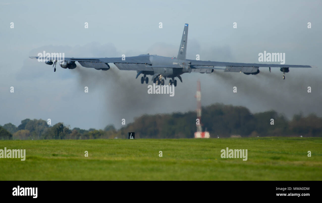A B-52 Stratofortress takes off the runway at Fairford Royal Air Force Base, Sept. 22, 2017. U.S. Strategic Command bomber forces regularly conduct combined theater security cooperation engagements with allies and partners, demonstrating the U.S. capability to command, control and conduct bomber missions across the globe. Bomber missions demonstrate the credibility and flexibility of the military's forces to address today's complex, dynamic and volatile global security environment. (U.S. Air Force photo/Staff Sgt. Benjamin Raughton) Stock Photo