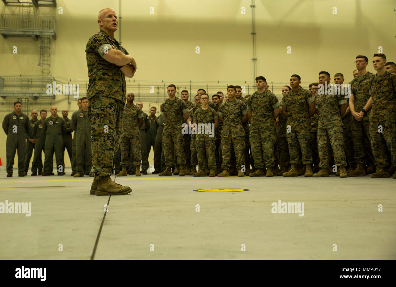 U.S. Marine Corps Brig. Gen. Thomas D. Weidley, commanding general of 1st Marine Aircraft Wing, talks to Marines with Marine Aerial Refueler Transport Squadron (VMGR) 152 at Marine Corps Air Station Iwakuni, Japan, Sept. 27, 2017. Weidley visited to interact with Marines and further his knowledge of everyday operations on the air station. (U.S. Marine Corps photo by Lance Cpl. Gabriela Garcia-Herrera) Stock Photo