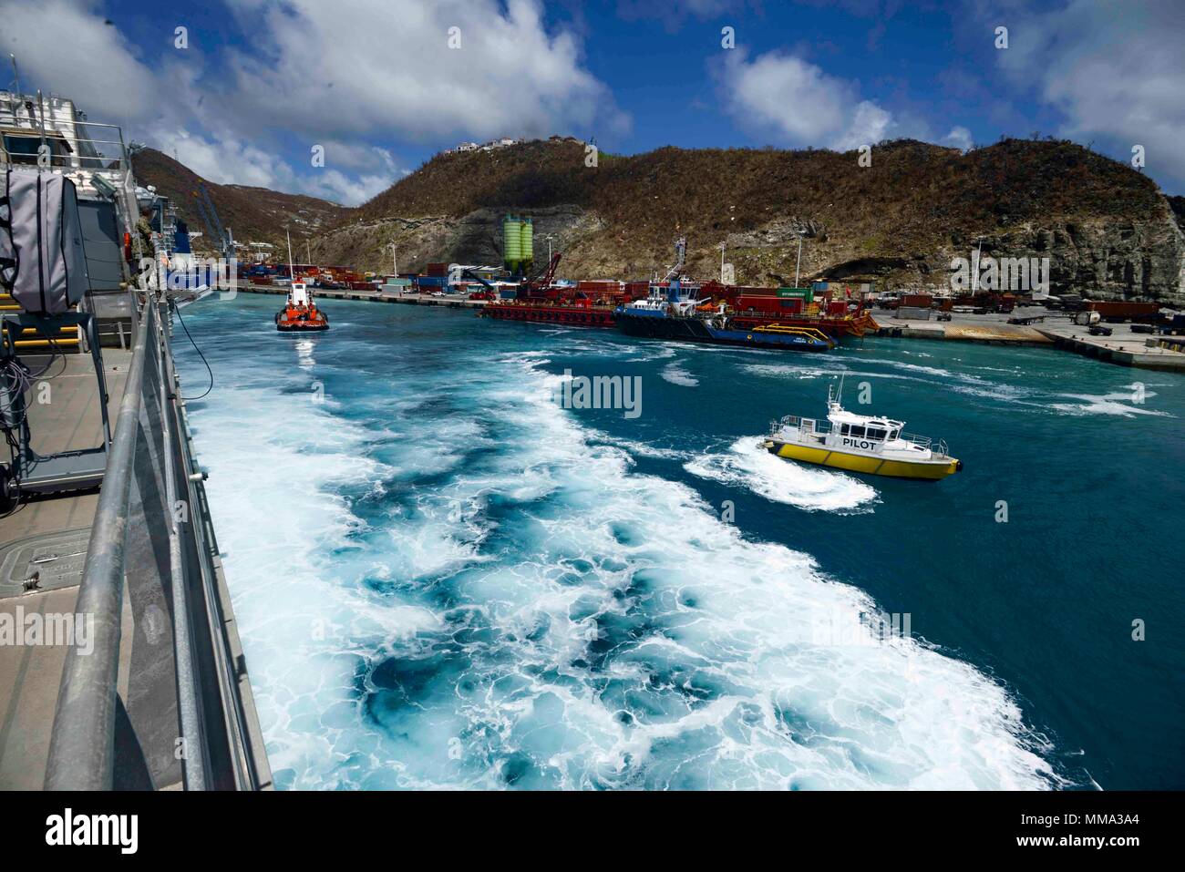 170917-N-KW679-0057 PHILIPSBURG, Sint Maarten (September 17, 2017) A pilot vessel and tugboat pull away from expeditionary fast transport vessel USNS Spearhead (T-EPF 1) as it departs the island of St. Martin. Spearhead assisted in humanitarian aid and disaster relief efforts for people affected by Hurricane Irma. SPS 17 is a U.S. Navy deployment executed by U.S. Naval Forces Southern Command/U.S. 4th Fleet, focused on subject matter expert exchanges with partner nation militaries and security forces in Central and South America. (U.S. Navy photo by Mass Communication Specialist 3rd Class Kris Stock Photo