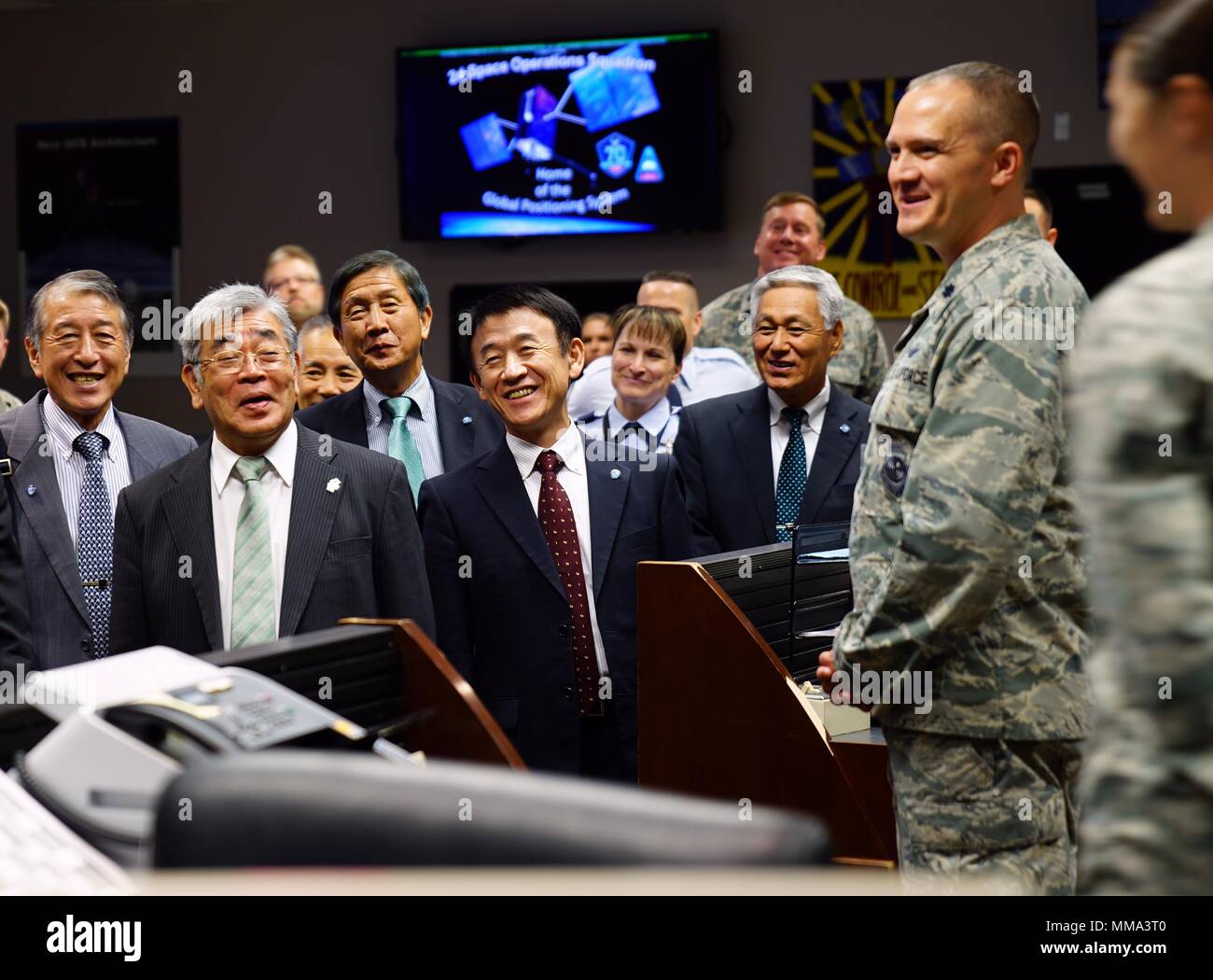 Lt. Col. Peter Norsky, 2nd Space Operations Squadron commander, laughs ...