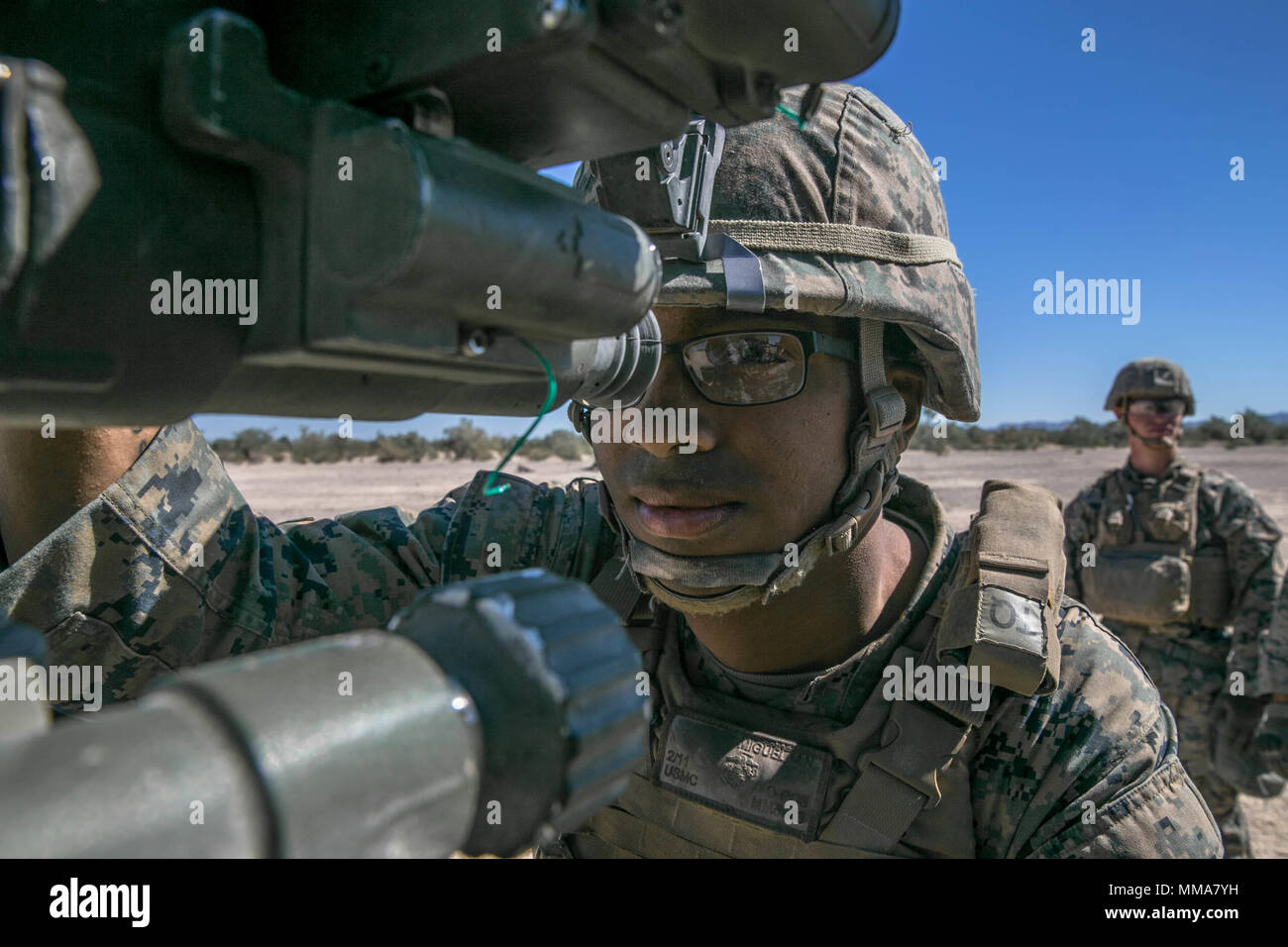 U.S. Marine Corps Lance Cpl. Malcom Miguel, a field artillery Marine with Echo Battery, 2nd Battalion, 11th Marine Regiment, prepares to fire a M777 towed 155 mm howitzer during Weapons and Tactics Instructors Course (WTI) 1-18 at Yuma, Ariz., on Sept. 30, 2017. WTI is a seven week training event hosted by Marine Aviation and Weapons Tactics Squadron One (MAWTS-1) cadre which emphasizes operational integration of the six functions of Marine Corps Aviation in support of a Marine Air Ground Task Force. MAWTS-1 provides standardized advanced tactical training and certification of unit instructor  Stock Photo