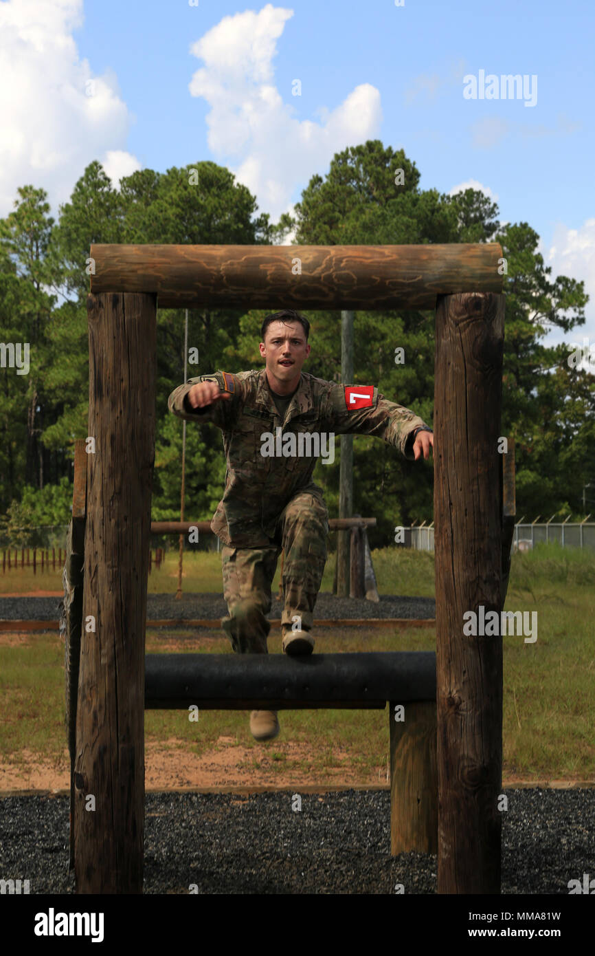 U.S. Army Staff Sgt. Eric Joiner, assigned to the Lyster Army Community Hospital, prepares to jump onto the Belly Buster obstacle during the 2017 Best Medic Competition at Fort Bragg, N.C., Sep. 18-21, 2017. The competition tested the physical and mental toughness, as well as the technical competence, of each medic to identify the team moving forward to represent the region at the next level of the competition.  (U.S. Army photo by Spc. Paris Maxey) Stock Photo