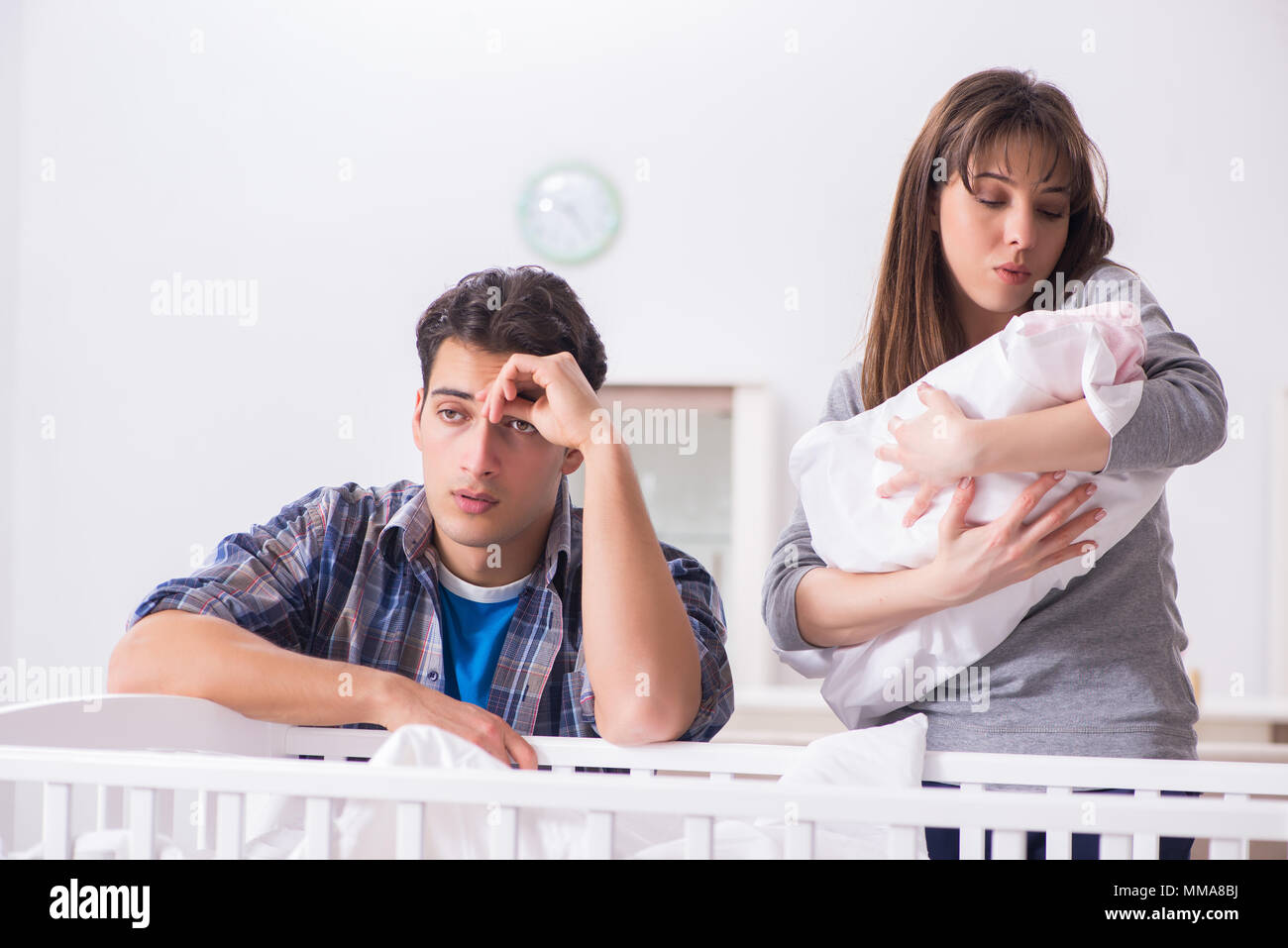 Young dad cannot stand baby crying Stock Photo - Alamy