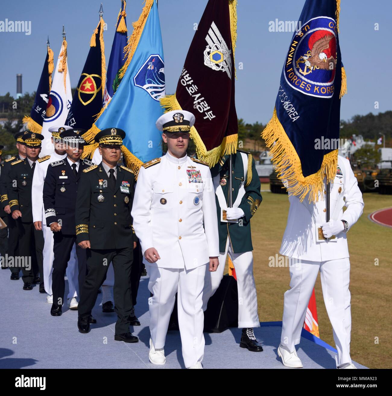170928-N-TB148-105 PYEONGTAEK, Republic of Korea (Sept. 28, 2017) Rear Adm. Brad Cooper, commander, Naval Forces Korea (CNFK), marches to the award stage during the 69th annual Republic of Korea (ROK) Armed Forces Day Ceremony. Armed Forces Day comemmorates the service of men and women in the ROK armed forces, the day that South Korea broke through the 38th parallel during the Korean War in 1950. Cooper is also presented the Presidential Unit Citation by ROK President Moon, Jae-in, this is the first time a U.S. Navy command is presented this award since the end of the Korean War.  (U.S. Navy p Stock Photo