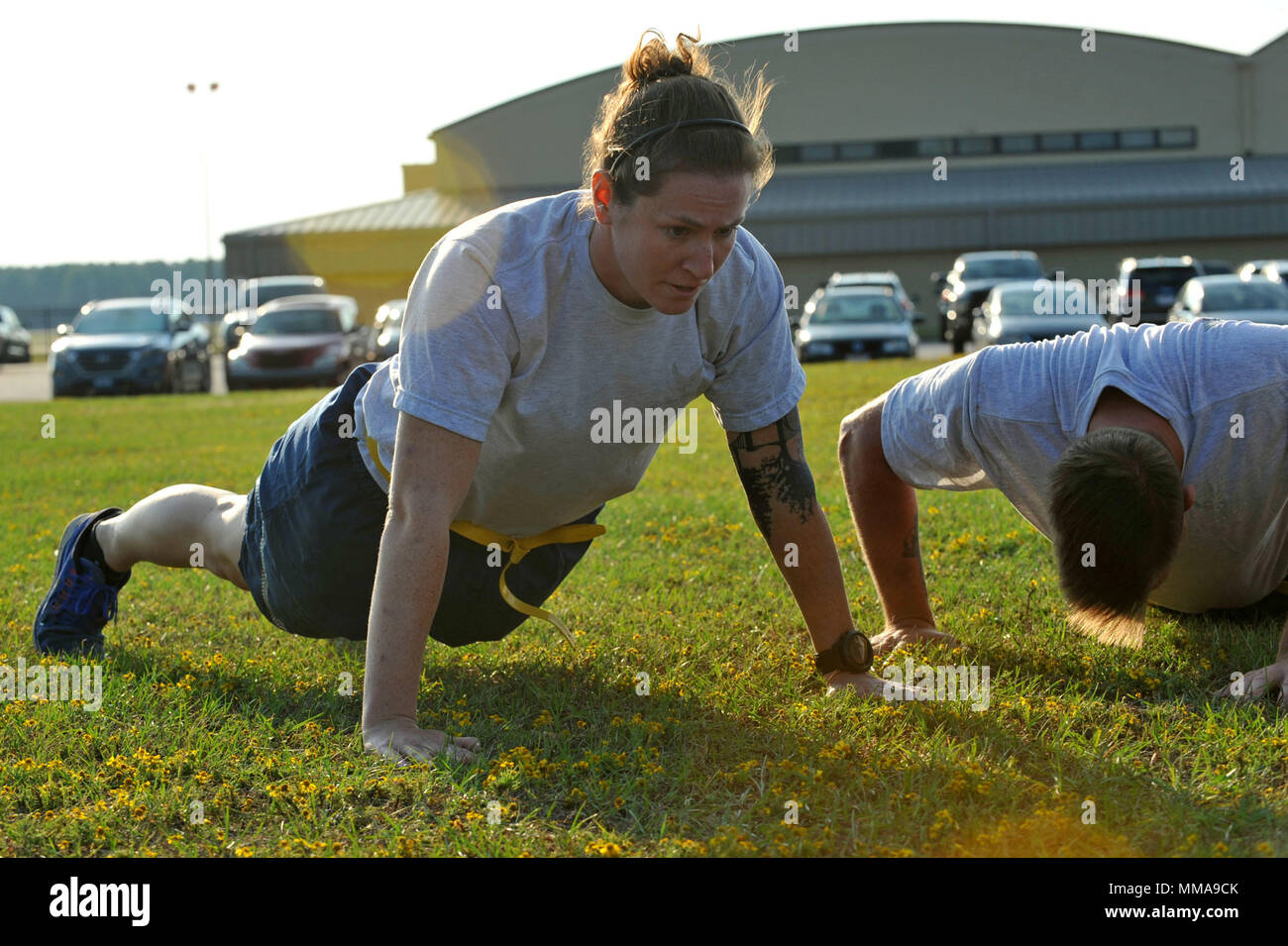 U.S. Air Force 1st Lt. Margaret Haley, 20th Civil Engineer Squadron  explosive ordnance disposal flight commander, performs pushups during a  Warrior Day challenge hosted by the 20th Medical Group at Shaw Air