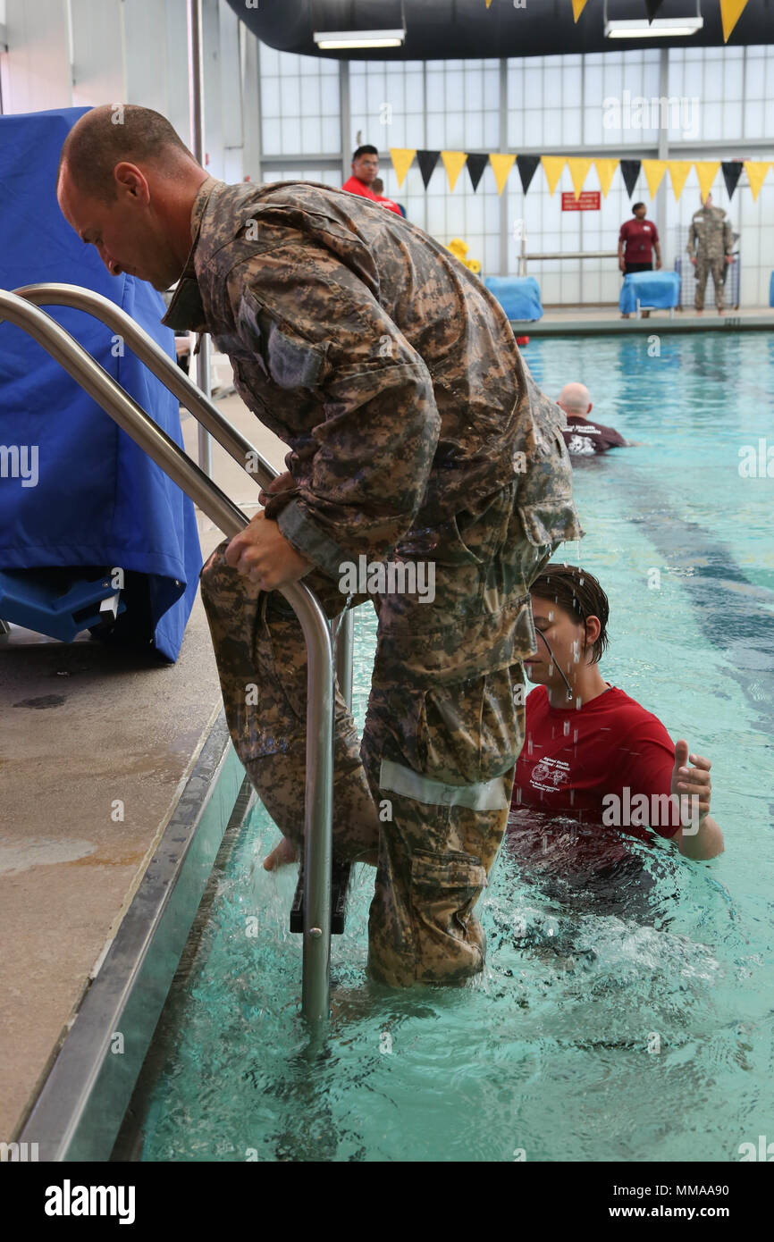 U.S. Army Sgt. 1st Class Zachary Dispennette, assigned to the McDonald Army Health Center, steps out of the pool during the 2017 Best Medic Competition at Fort Bragg, N.C., Sept. 19, 2017. The competition tested the physical and mental toughness, as well as the technical competence, of each medic to identify the team moving forward to represent the region at the next level of the competition.  (U.S. Army photo by Pfc. Meleesa Gutierrez) Stock Photo