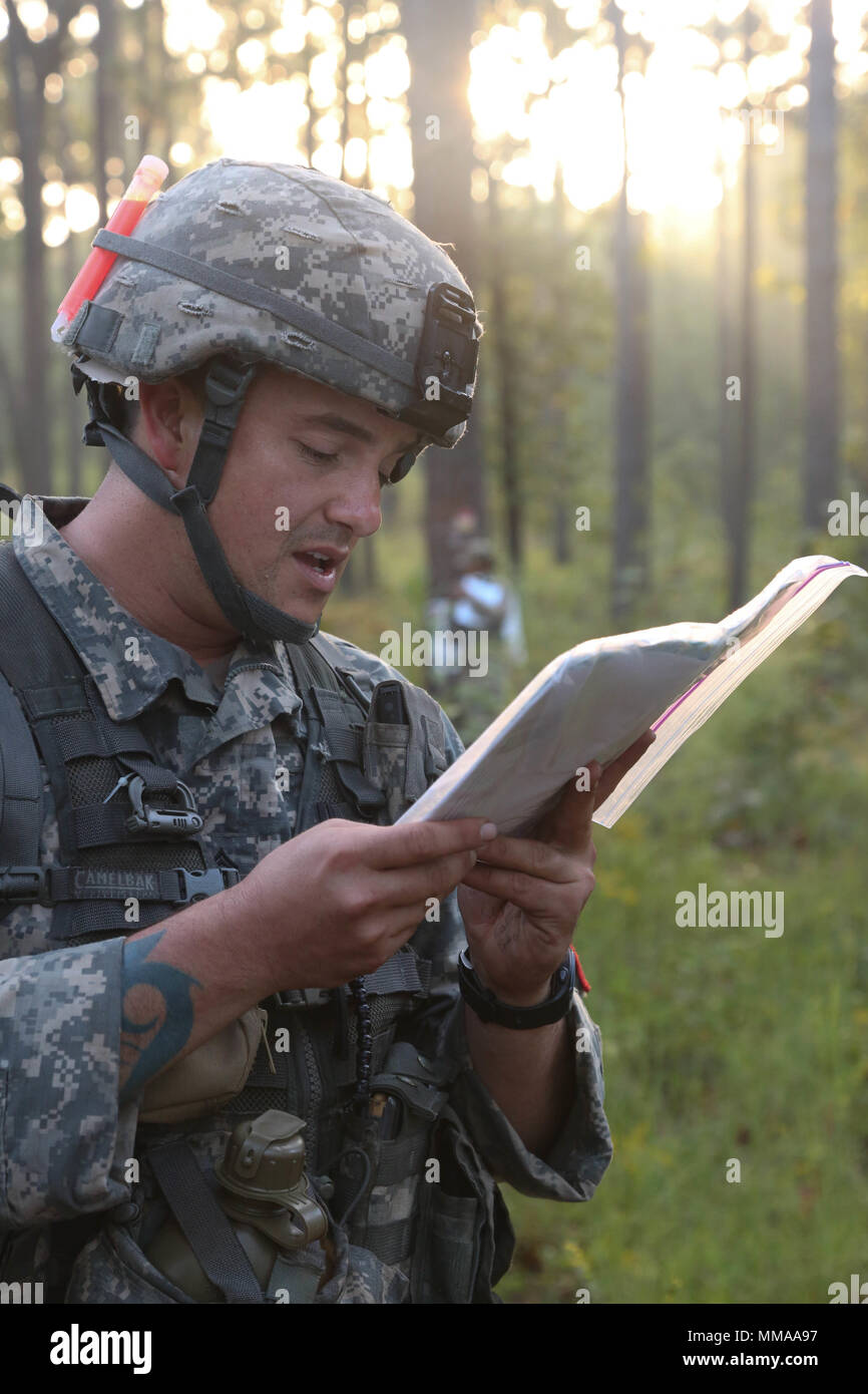 U.S. Army Staff Sgt. Tyler Sheeks, assigned to the Keller Army Community Hospital, reads map during the 2017 Best Medic Competition at Fort Bragg, N.C., Sept. 19, 2017. The competition tested the physical and mental toughness, as well as the technical competence, of each medic to identify the team moving forward to represent the region at the next level of the competition.  (U.S. Army photo by Pfc. Meleesa Gutierrez) Stock Photo