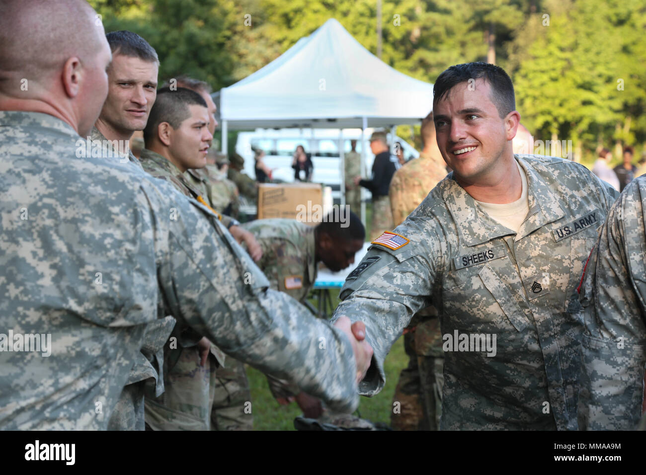 U.S. Army Staff Sgt. Tyler Sheeks, assigned to the Keller Army Community Hospital, shakes hands with fellow competitor Capt. Jeremy Lewis after the 2017 Best Medic Competition at Fort Bragg, N.C., Sept. 20, 2017. The competition tested the physical and mental toughness, as well as the technical competence, of each medic to identify the team moving forward to represent the region at the next level of the competition.  (U.S. Army photo by Pfc. Meleesa Gutierrez) Stock Photo