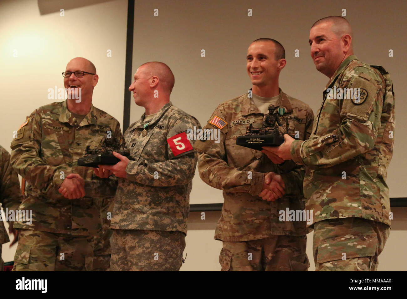 U.S. Army Capt. Jeremy Lewis and Staff Sgt. Joseph Karslo, assigned Public Health Command, receive awards during the 2017 Best Medic Competition Award Ceremony at Fort Bragg, N.C., Sept. 20, 2017. The competition tested the physical and mental toughness, as well as the technical competence, of each medic to identify the team moving forward to represent the region at the next level of the competition.  (U.S. Army photo by Pfc. Meleesa Gutierrez) Stock Photo