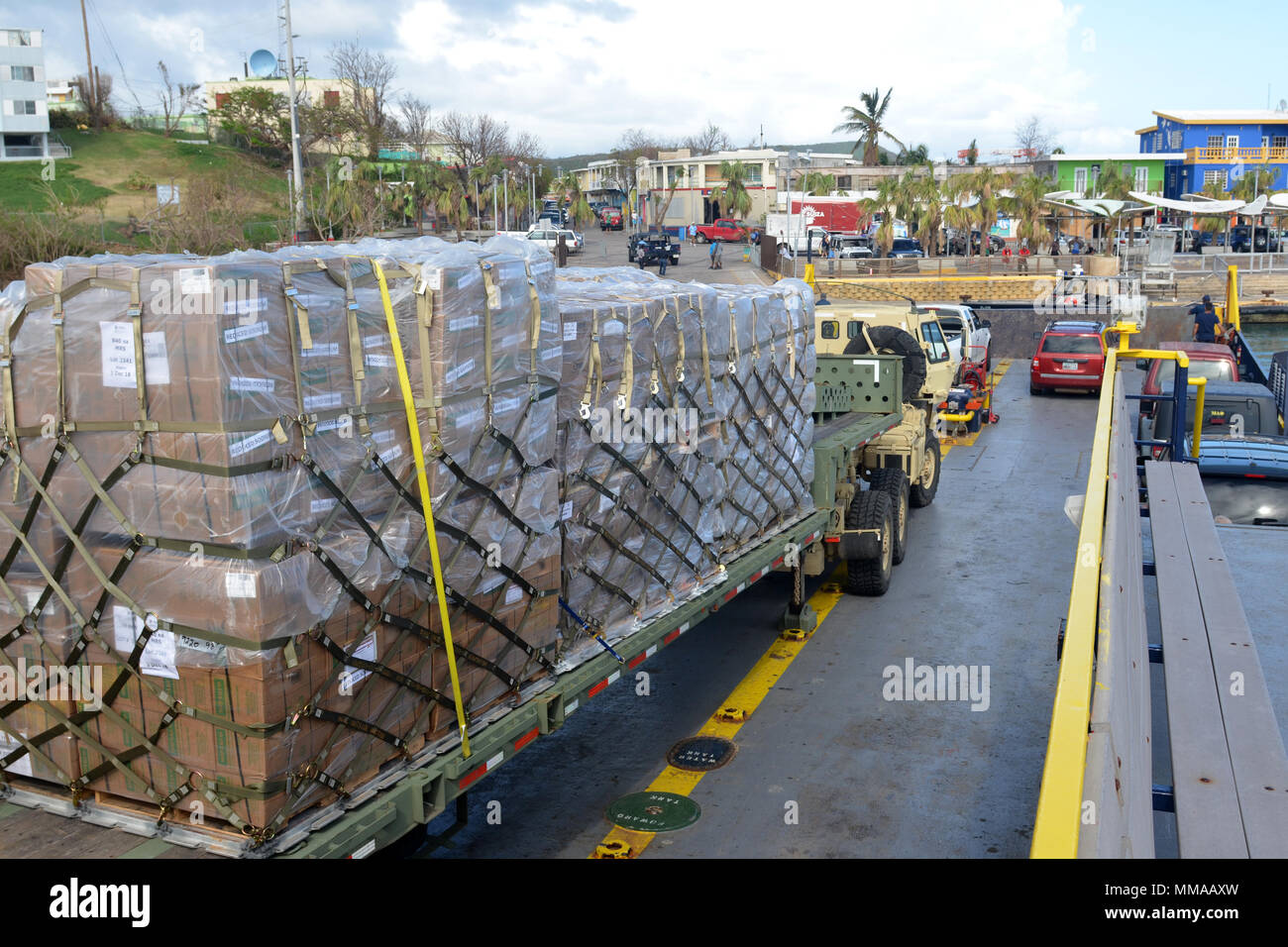 A Puerto Rico Army National Guard M1088 tractor truck loaded with 24 pallets of emergency ration